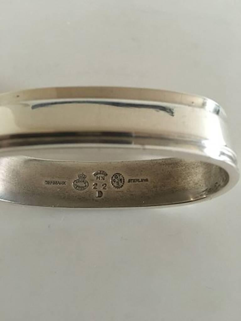Georg Jensen sterling silver pyramid large napkin ring #22D. Measures: 5.5 cm / 2 11/64 in. Weighs: 49 gram / 1.70 oz.