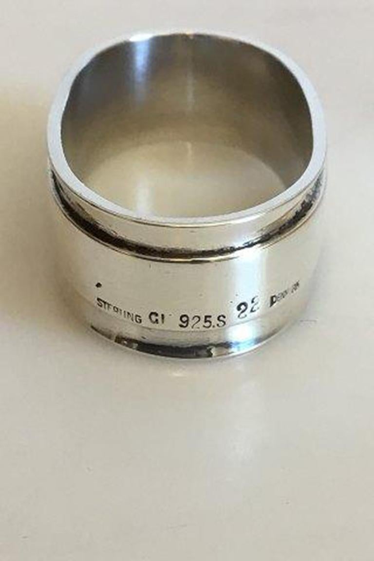 Georg Jensen Sterling Silver Pyramid Napkin Ring No 22.

Measures 5.4 cm / 2 1/8 in. x 3 cm / 1 3/16 in. Weighs 33.7 g / 1.19 oz.