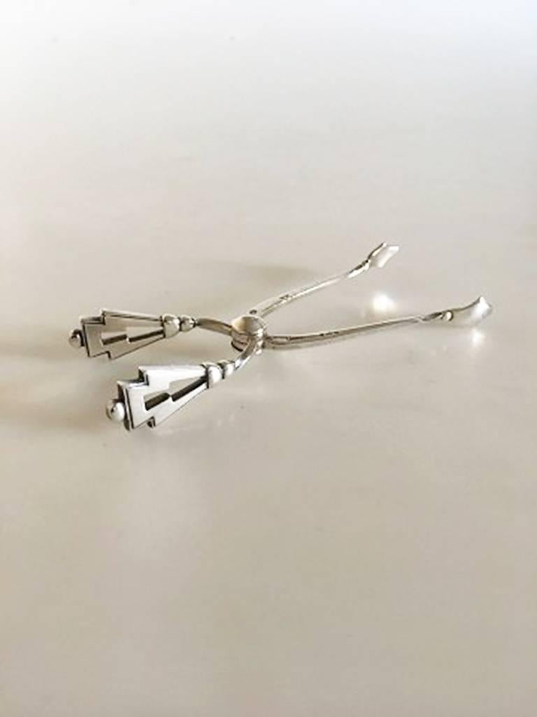 Georg Jensen sterling silver Pyramid sugar tongs #174. Measures: 11 cm / 4 21/64 in.
