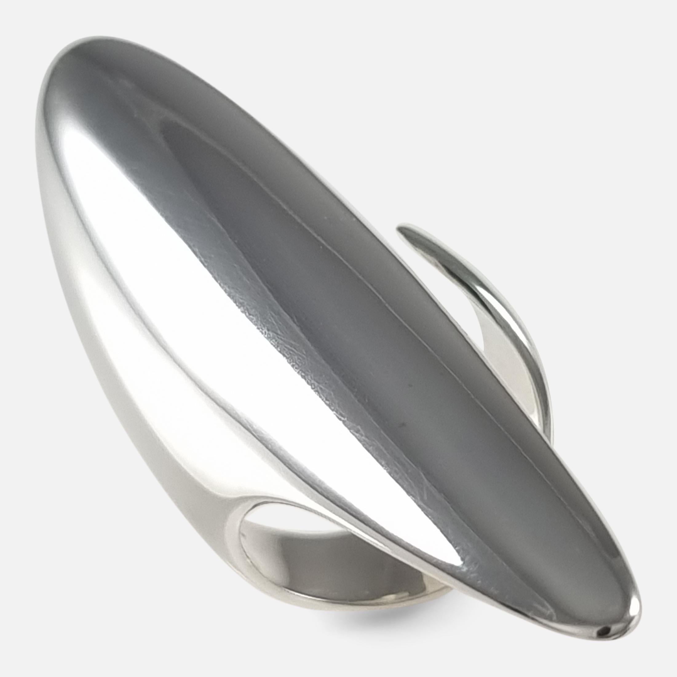 A sterling silver modernist ring #99, designed by Henning Koppel for Georg Jensen. 

Stamped Georg Jensen within dotted oval mark, '925 S', 'Denmark', & '99'. The ring is UK hallmarked, 925.

Period: - Late 20th Century.

Date: - Circa