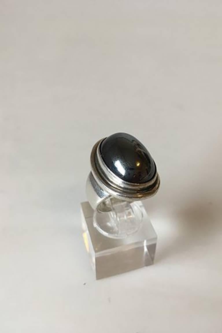 Georg Jensen Sterling Silver Ring No 46A with Hematite. From after 1945.
Ring Size 50 / US 5 1/4
Ornament measures 2 cm / 0 25/32 in. x 1.5 cm / 0 19/32 in.
Weighs 15 g / 0.55 oz