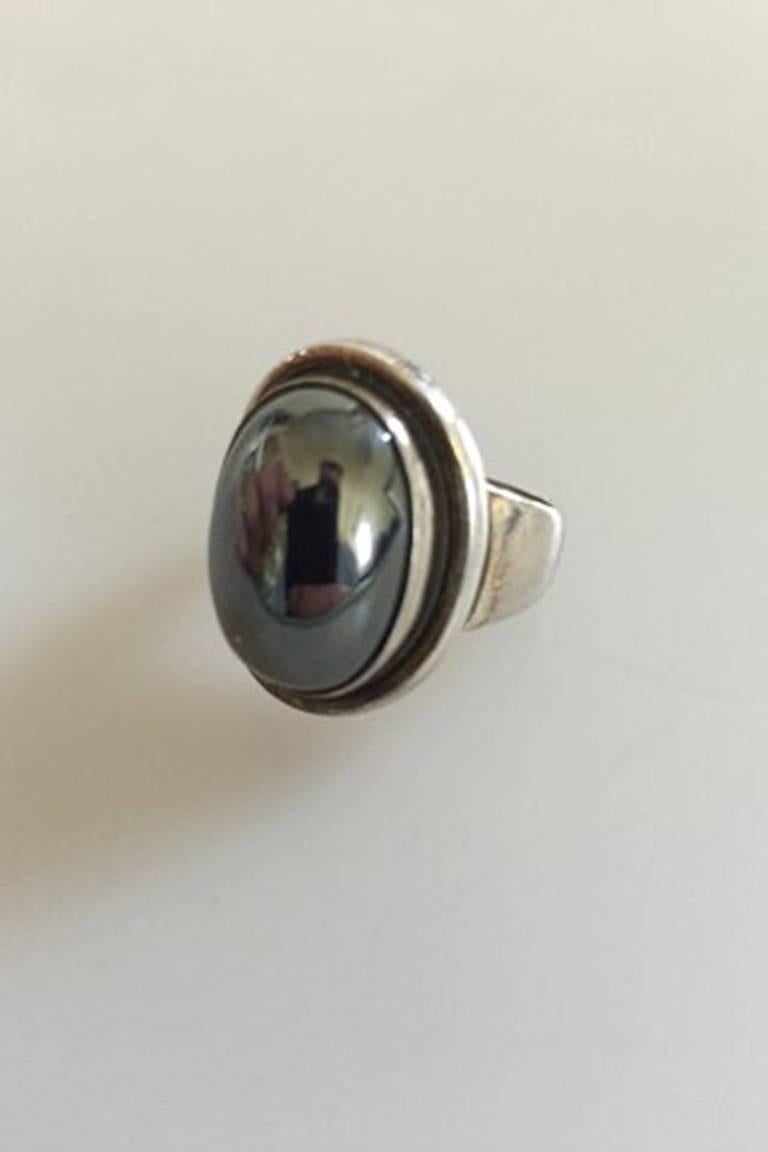 Georg Jensen Sterling Silver Ring No 46A with Hematite. From after 1945.
Ring Size 53 / US 6 1/2. 
Ornament measures 2 cm / 0 25/32 in. x 1.5 cm / 0 19/32 in.
Weighs 12.5 g / 0.45 oz.
