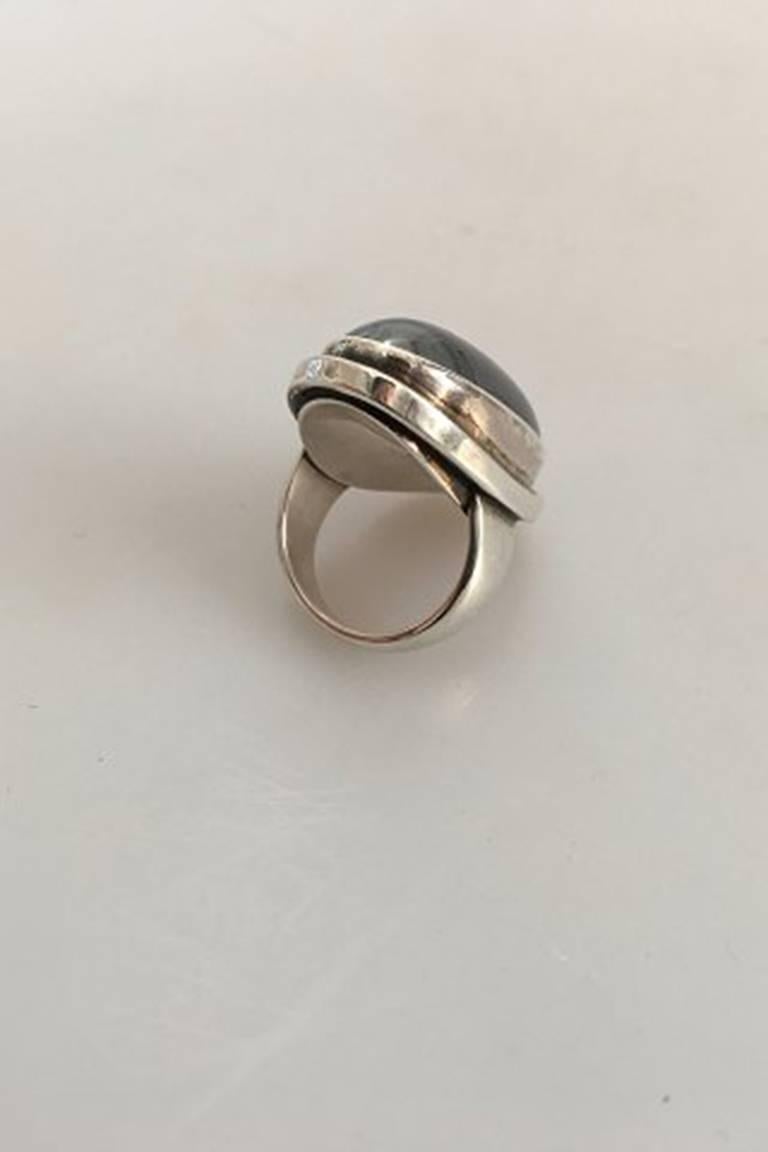 Georg Jensen Sterling Silver Ring No 46E ornamented with Hematite. From after 1945. 
Ring Size 55 / US 7 1/4. Weighs 23 g / 0.80 oz. Measures 3.5 cm / 1 3/8 in. x 2 cm / 0 25/32 in.