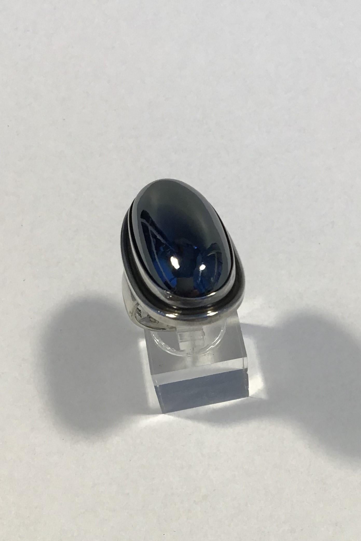 Georg Jensen Sterling Silver Ring No 46E with Hematite Stone. 

Ring Size 47 / US 4. 
Weighs  23.8 g / 0.84 oz. 
Measures 3.5 cm / 1 3/8 in. x 2 cm / 0 25/32 in.