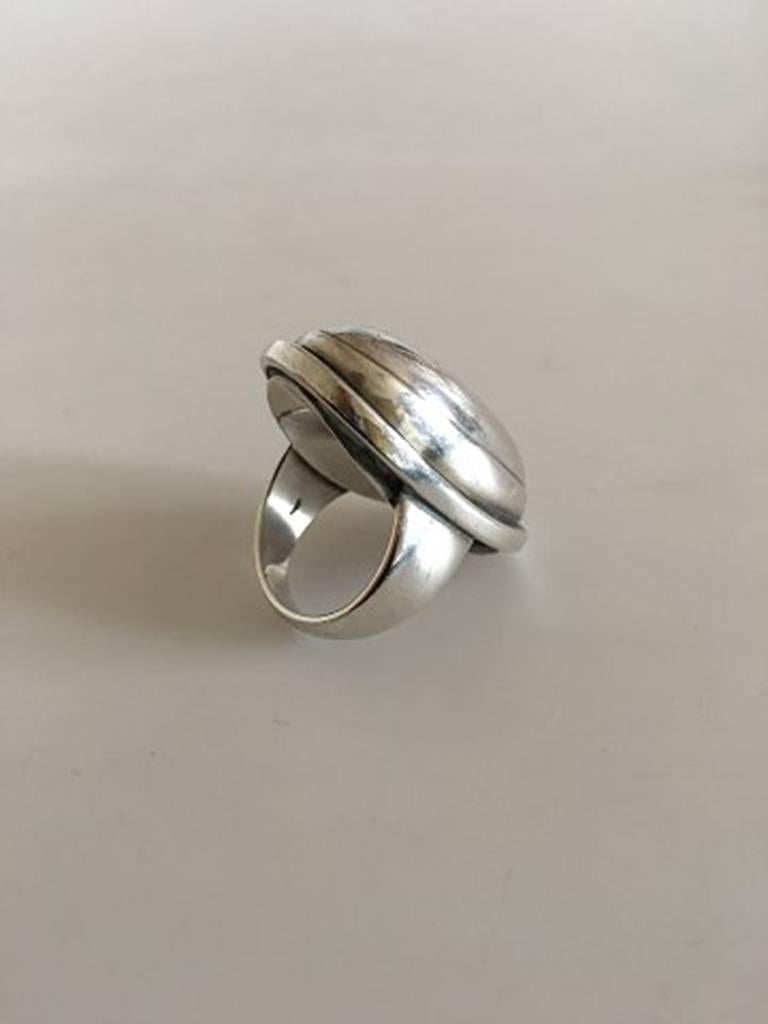 Georg Jensen Sterling Silver Ring No 46E with Silver Stone. Ring Size 52 / US 6. The oval silver ornament measures ca. 3.5 cm / 1 3/8 in. In great condition.