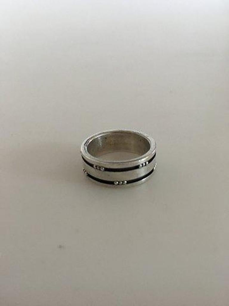 Georg Jensen Sterling Silver Ring No 60D. Ring Size 51 / US 5 1/2.

Measures 7 mm wide. Weighs 6 g / 0.21 oz.