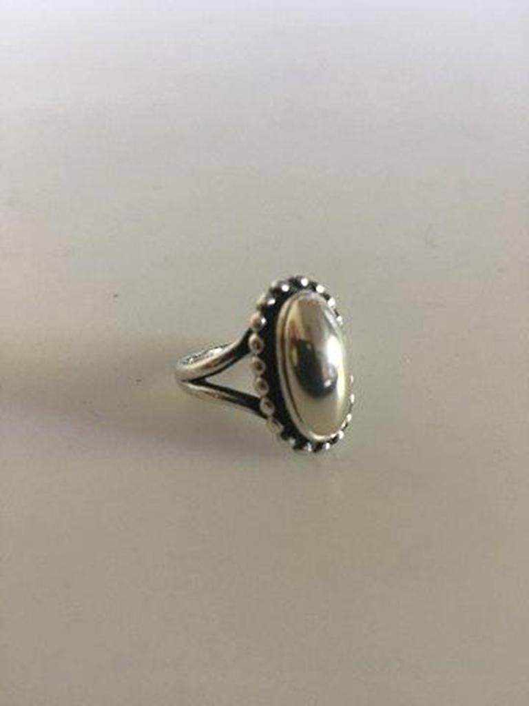 Georg Jensen sterling silver ring no 9 with silver stone.

Ring Size 52 / US 6. Weighs 4.7 g / 0.17 oz. From after 1945.