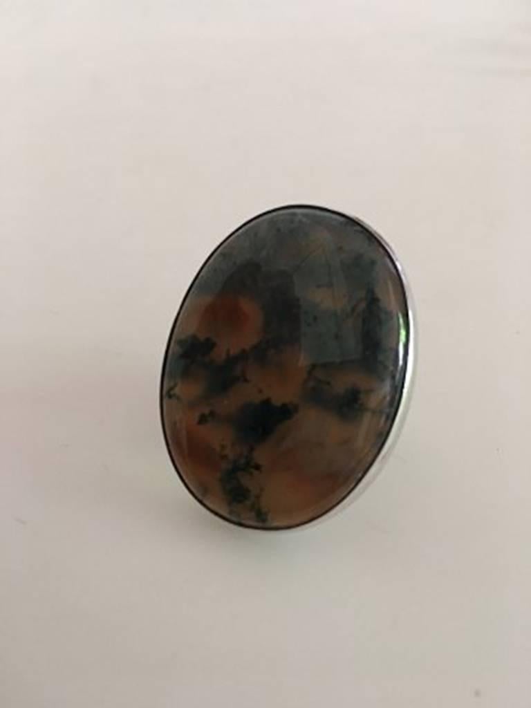 Georg Jensen Sterling Silver Ring No 90D with Oval Stone, Grey and Orange. Ornament measures 3.5 cm / 1 3/8 in. x 2.5 cm / 0 63/64 in. Ring Size 48 / US 4 1/2. Weighs 16 g / 0.60 oz. Made after 1945.