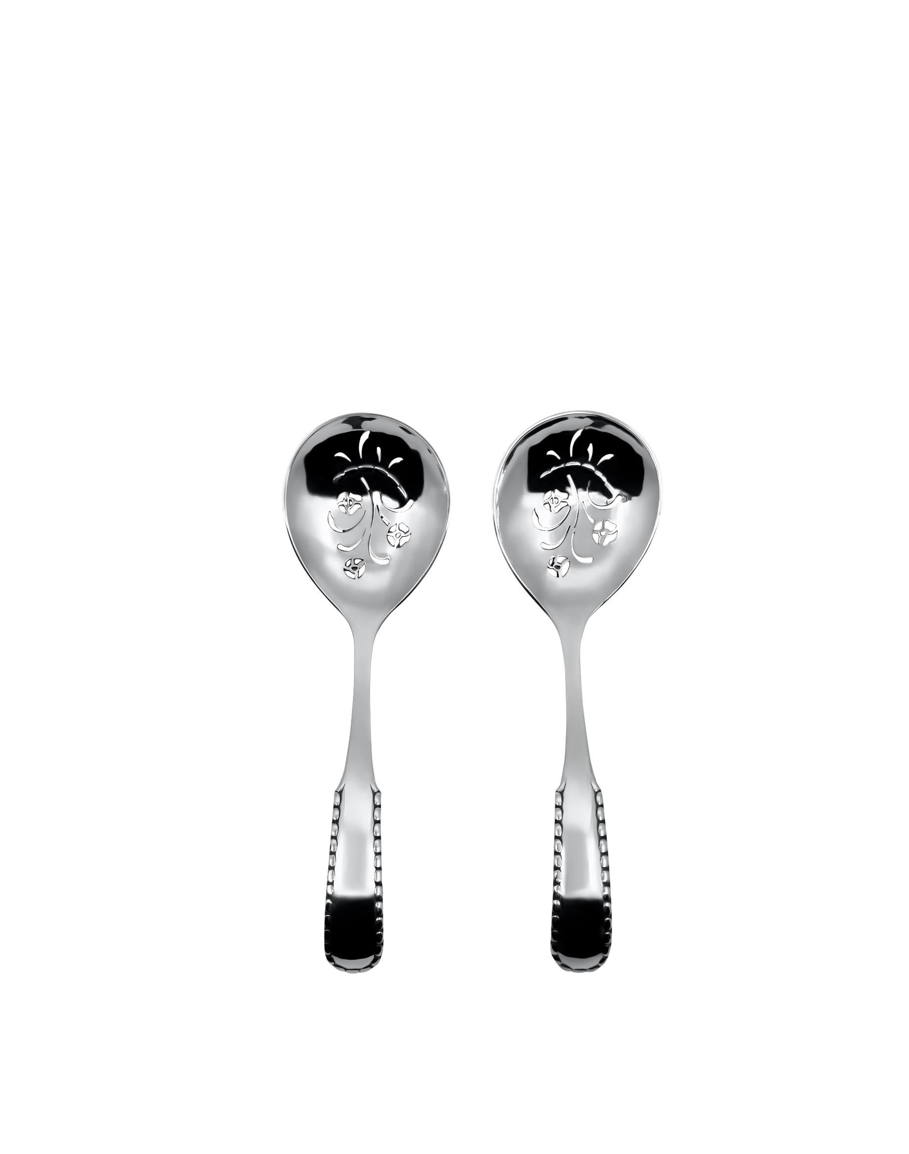 a set of two Rope/Perle pattern antique sugar sifters crafted in 830 sterling silver by Georg Jensen.  Each sifter is meticulously hand-forged, adorned with intricate cut-out floral designs. Both pieces bear matching hallmarks indicative of their