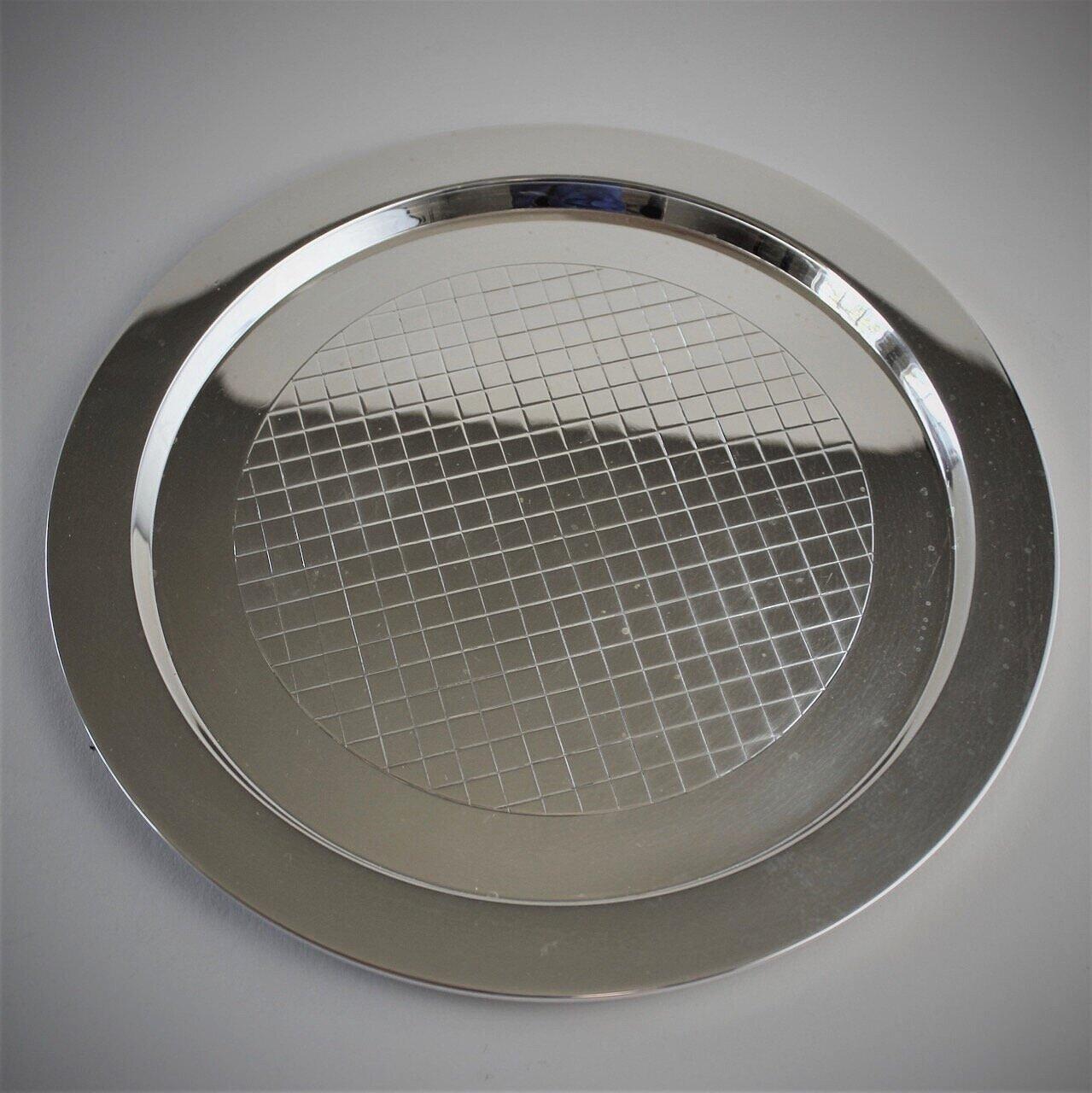 Georg Jensen sterling silver round drinks tray, No.819A by Sigvard Bernadotte.

Perfect bar tray.

A similar example can be seen in the book Georg Jensen Holloware, The Silver Fund collection by David Taylor and Jason Laskey, pg