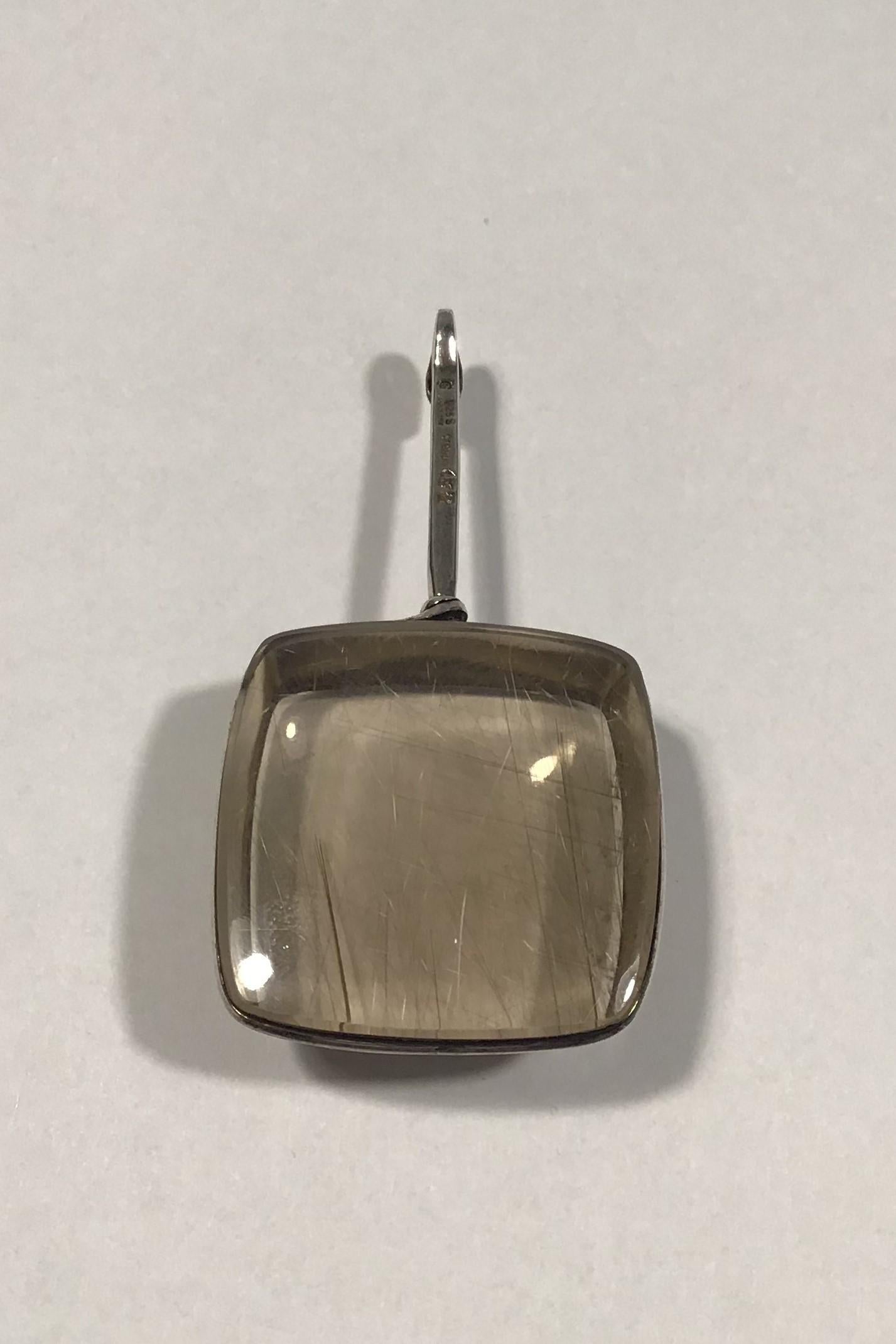 Georg Jensen Sterling Silver Smoke-coloured Rutile Quartz Pendant No 132 Torun 

Stone measures 3.4 cm x 3.4 cm( 1 11/32 in x 1 11/32 in) 
L 6.7 cm(2 41/64 in)
Weight 41.8 gr/ 1.47 oz