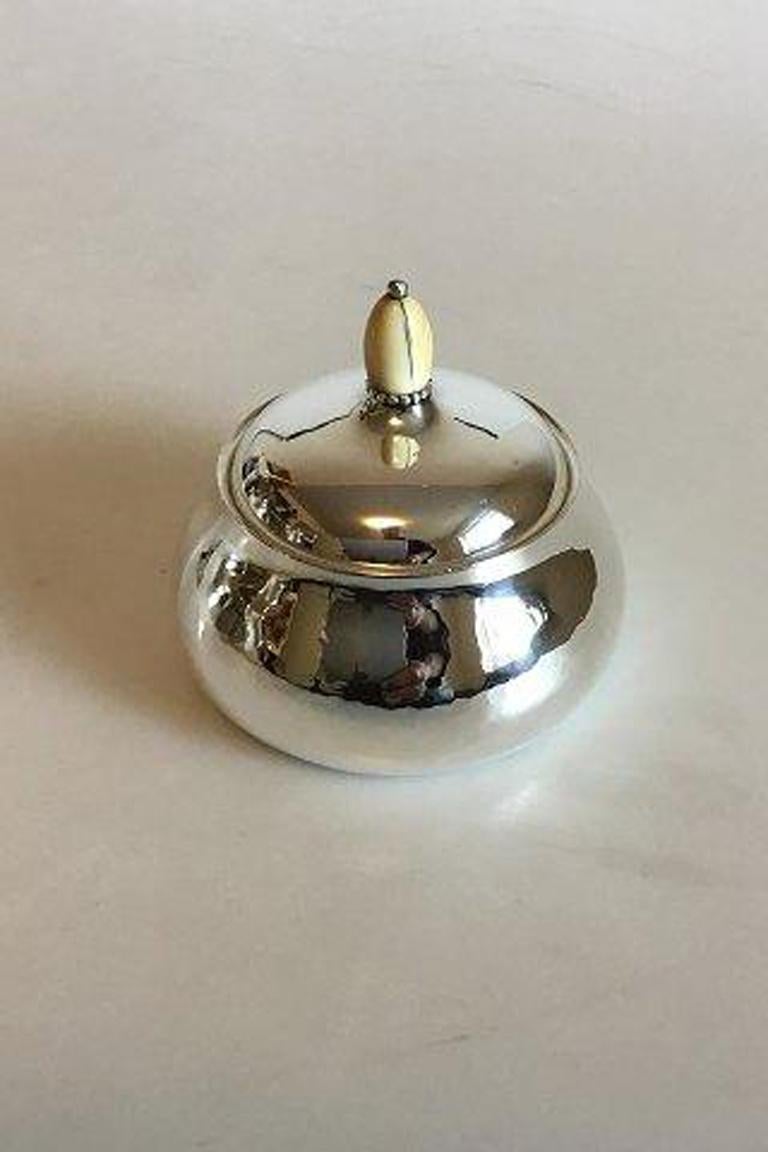 Georg Jensen sterling silver sugar bowl No 80A. 

Measures 8.5 cm / 3 11/32 in. x 9 cm / 3 35/64 in. Weighs 138 g / 4.85 oz.