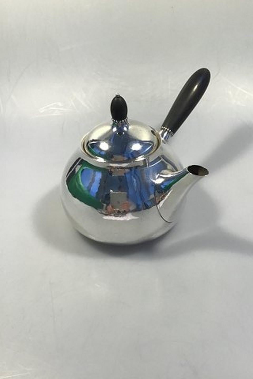 Georg Jensen sterling silver tea pot No 80B with ebony handle
Measures: Height 14.0 cm/5.51