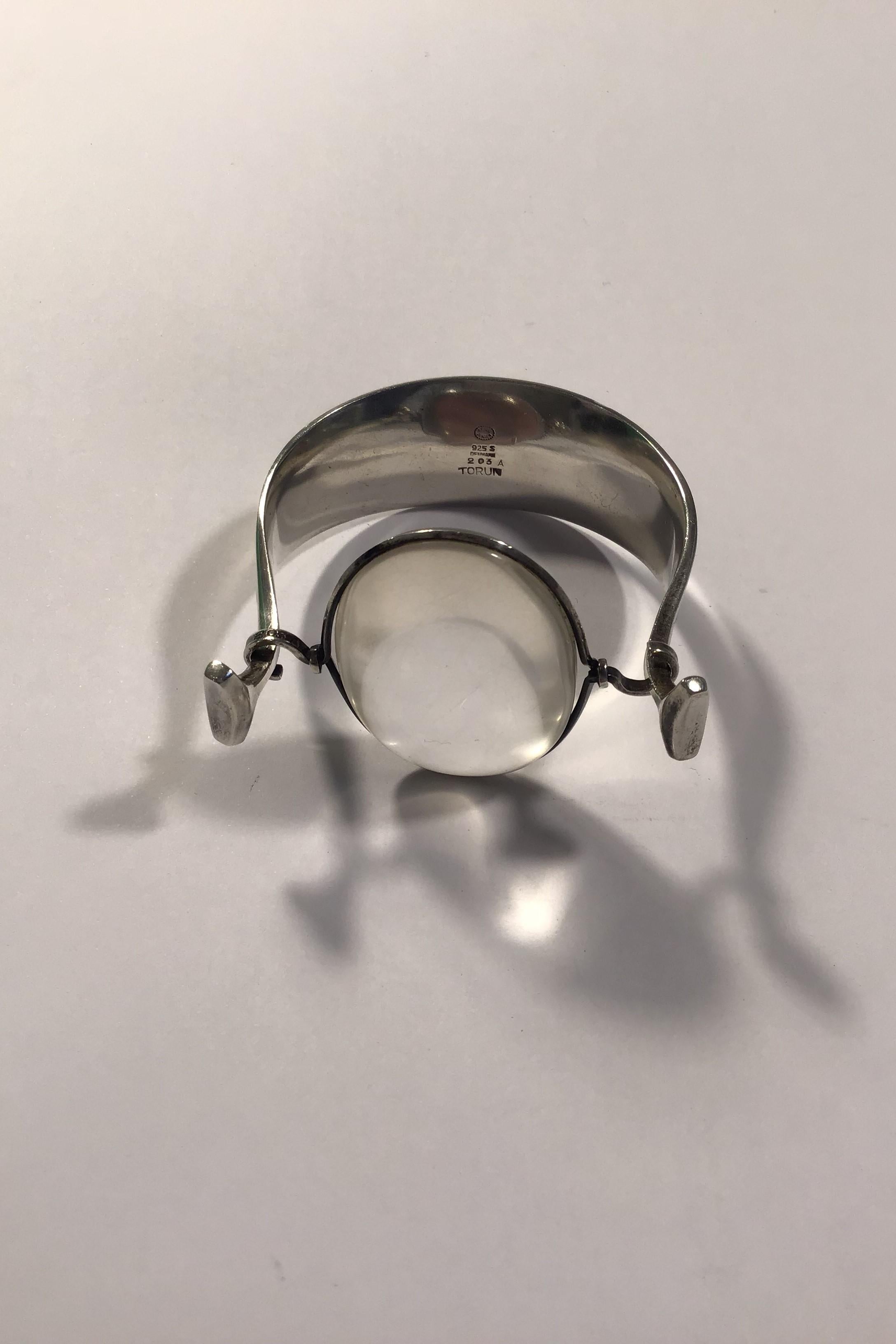 Georg Jensen Sterling Silver Torun Armring with Rutile Quartz No 203. The armring has a diameter of approx. 6 cm / 2 23/64 in. Weighs 55 g / 1.95 oz.