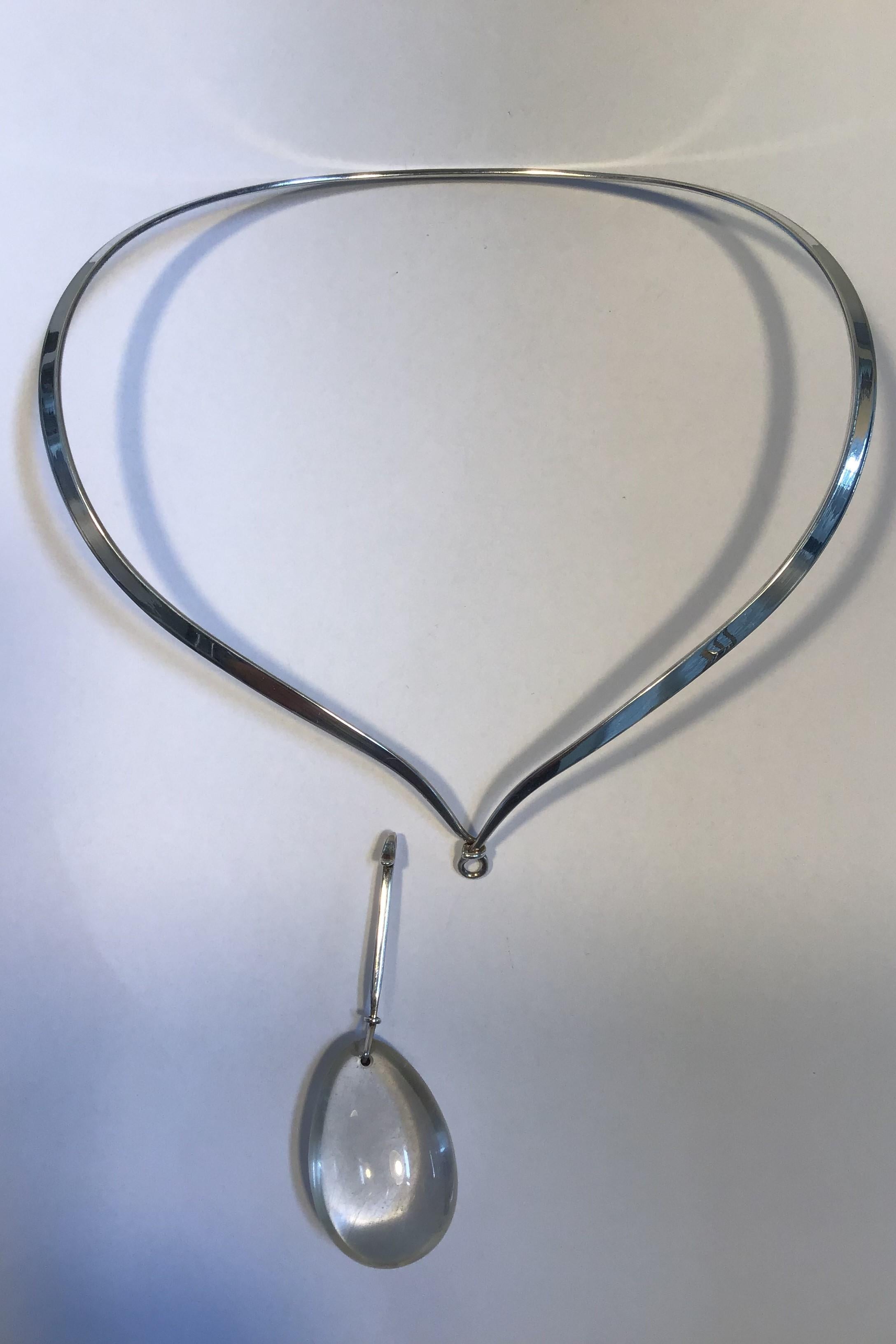 Georg Jensen Sterling Silver Torun Neck Ring No 169 and Rutile Quartz Pendant No 131 

Neck Ring No 169 Diam 15.5 cm(6.1 in ) Weight 36.3 gr/1.28 oz 
Pendant No 131 8.5 cm L(3.34 in) Weight 32.2 gr/1.14 oz