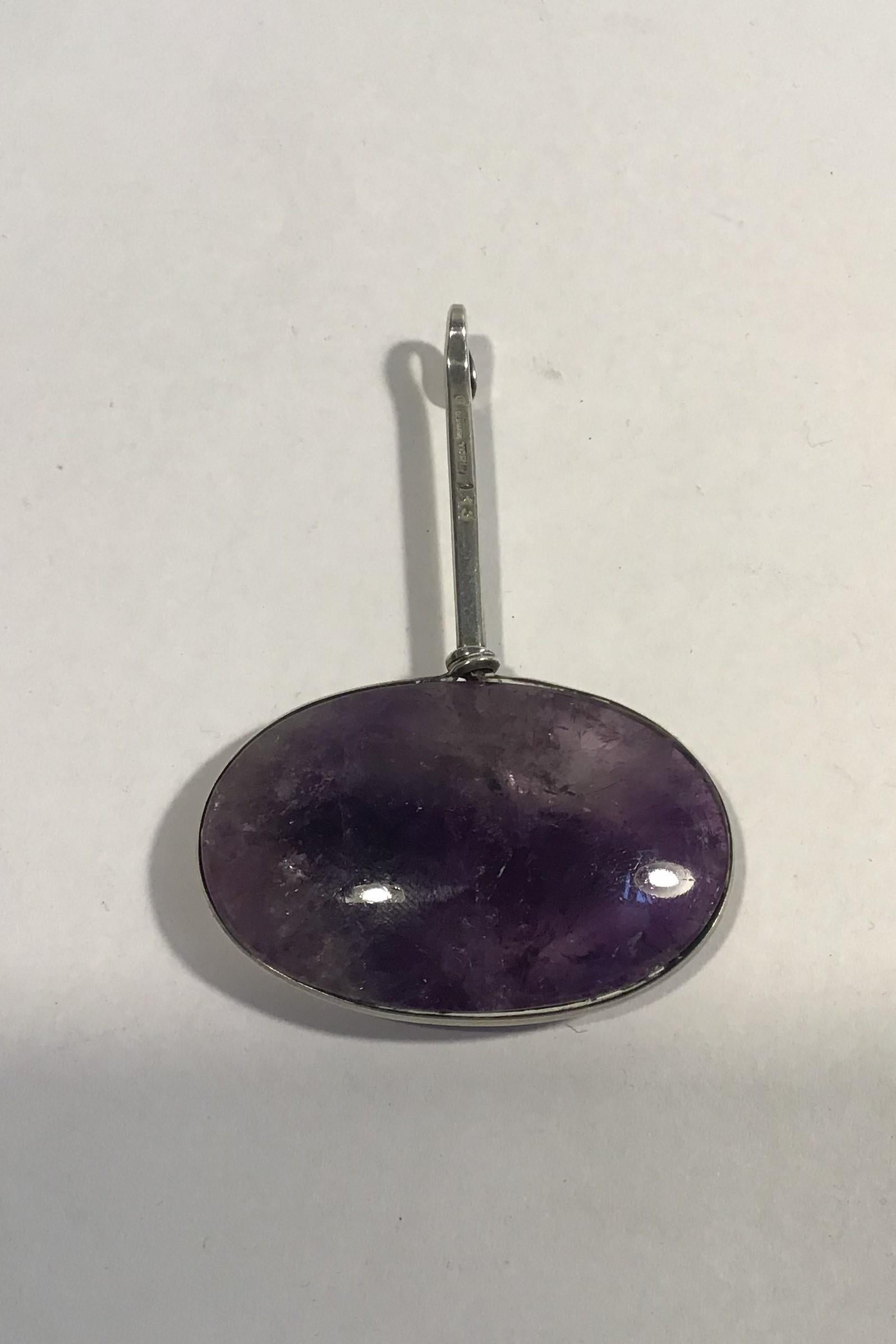 Georg Jensen Sterling Silver Torun Pendant No 133

Measures L 6.7 cm (2 23/32 in) 
Weight 21.8 gr/ 0.77 oz (Chipped stone)

