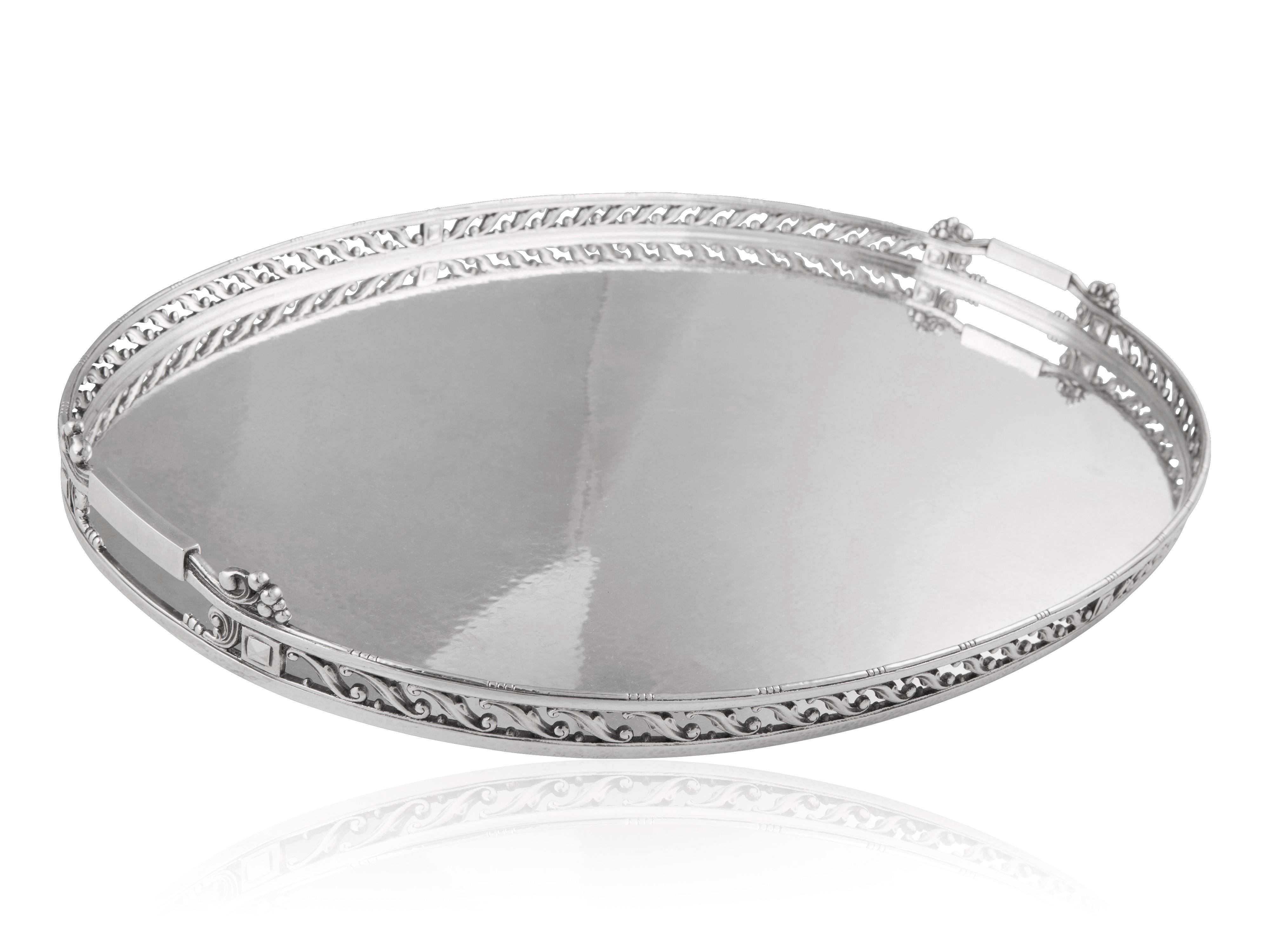 An exceptionally rare sterling silver tray from Georg Jensen, this piece showcases the distinctive design #332B by Johan Rohde, dating back to 1919. Often referred to as the “bridge tray,” this large oval tray is meticulously handcrafted. Noteworthy