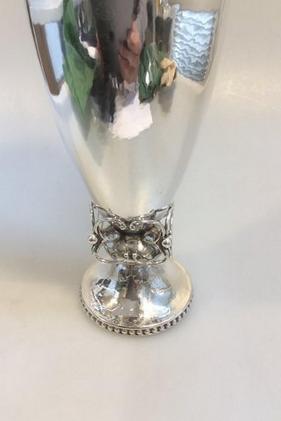 Georg Jensen Sterling Silver Vase with ornamentation no 301 A
Designed by Georg Jensen and from 1933-1944.

Measures 26cm / 10 1/4