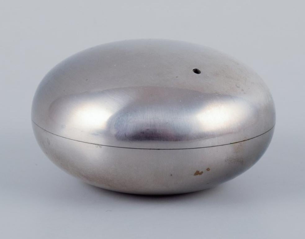 Danish Georg Jensen, three pieces in stainless steel. Salt & pepper shakers, ashtray.