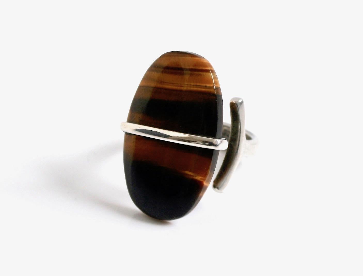 Early vintage Georg Jensen sterling silver & Tiger Eye ring designed by Vivianna Torun Bulow-Hube Denmark c.1960 
Design number 190 comes in the original Georg Jensen box
The Tigers eye/Banded Agate is a beautiful colour
Size UK P