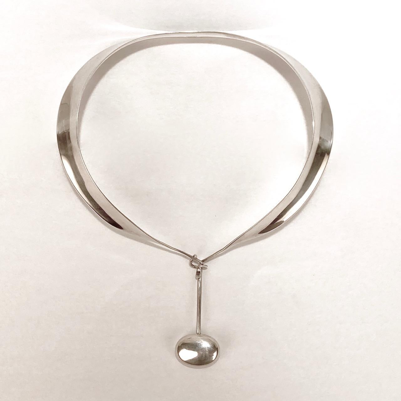 A wonderful Georg Jensen Torun Necklace in sterling silver.

Consisting of a model no. 160 choker neckpiece together with a model no. 301 pendant.

Marked for Georg Jensen, Torun, Denmark, 925s for sterling silver fineness, and with the model