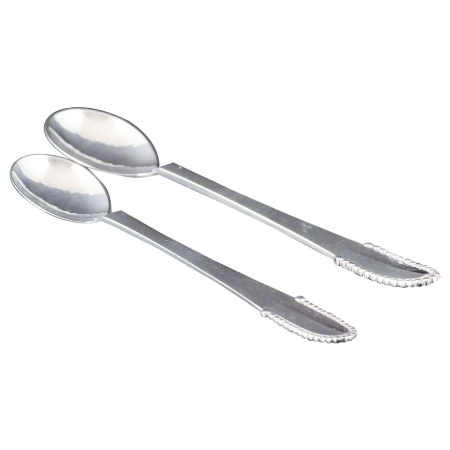 Georg Jensen. Two spoons in the “beaded” pattern. Sterling silver. For Sale