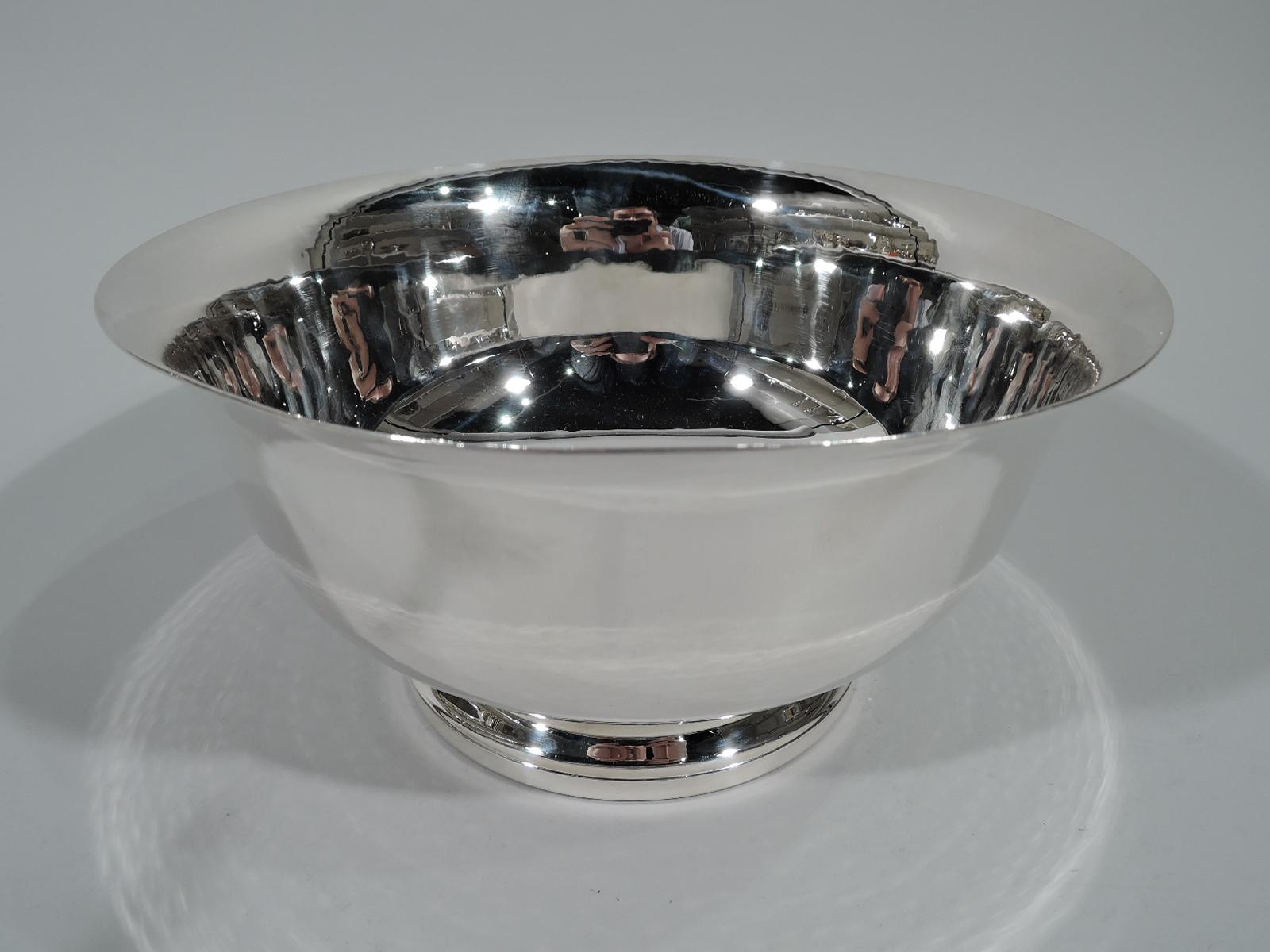Hand-hammered sterling silver Revere bowl. Retailed by Georg Jensen Inc. USA in New York. Traditional form with curved sides, flared rim, and stepped foot. Probably made by Worden-Munnis, a Boston maker that was founded in 1940 and specialized in