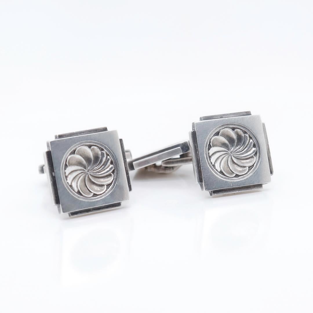 A pair of fine Georg Jensen USA cufflinks.

In sterling silver.

Design by Henry Pilstrup for Georg Jensen. 

Unlike the majority of Georg Jensen USA pieces, these cufflinks are based on a design created by Henry Pilstrup for the Danish Georg Jensen