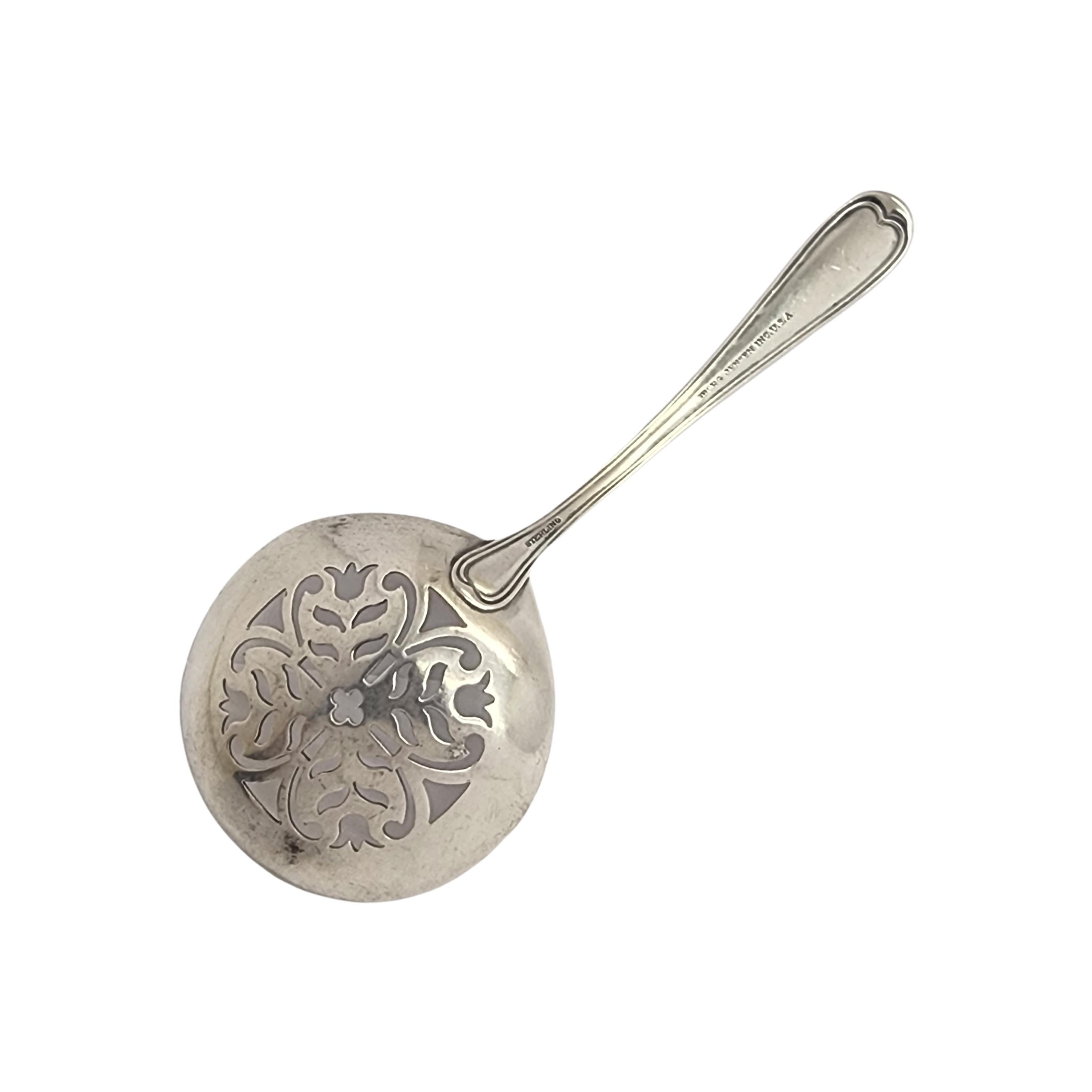 Sterling silver sugar sifter by Georg Jensen Inc USA.

No monogram

Small floral design on handle, ornate cut-out design on bowl.

Measures approx 4 3/4
