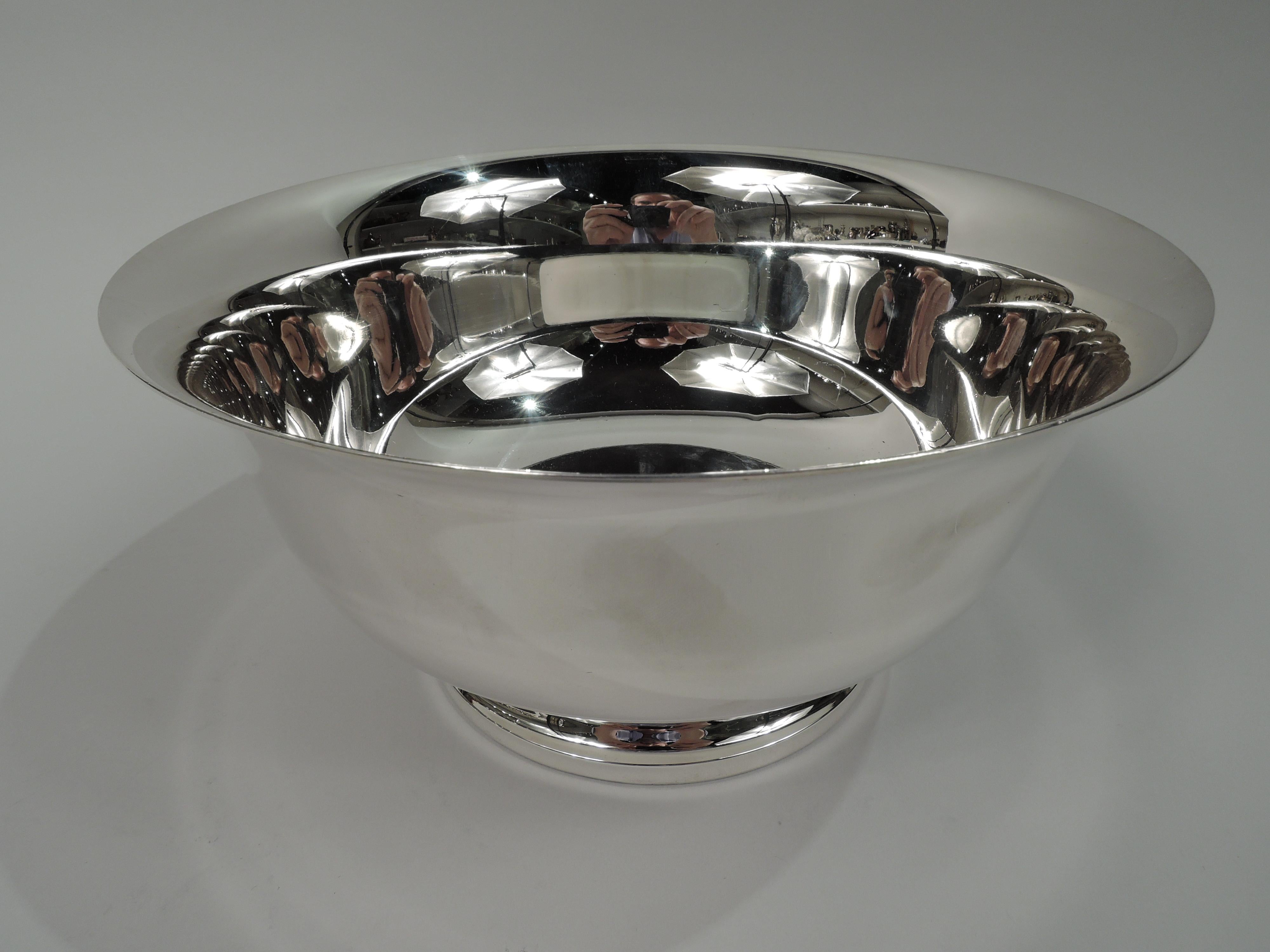 American Colonial sterling silver bowl. Retailed by Georg Jensen USA in New York. Revere form with Tapering sides, flared rim, and curved bottom; stepped foot. Traditional form with lots of room for engraving. Fully marked including retailer’s