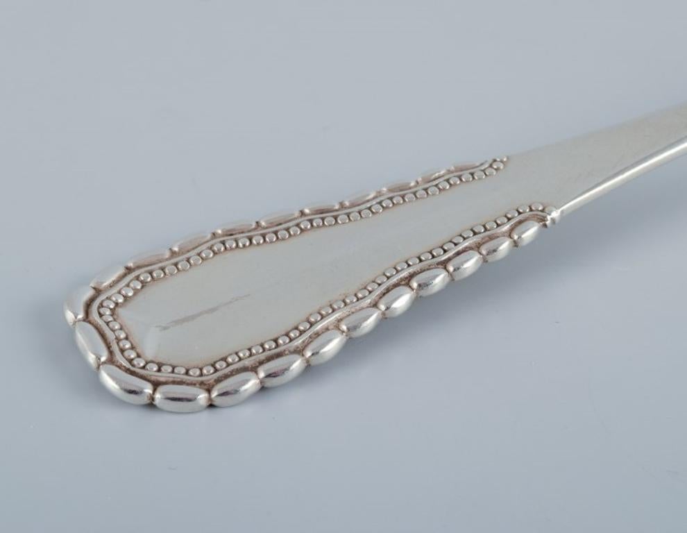 Danish Georg Jensen, Viking, serving spoon in 830 silver. Dated 1928 For Sale