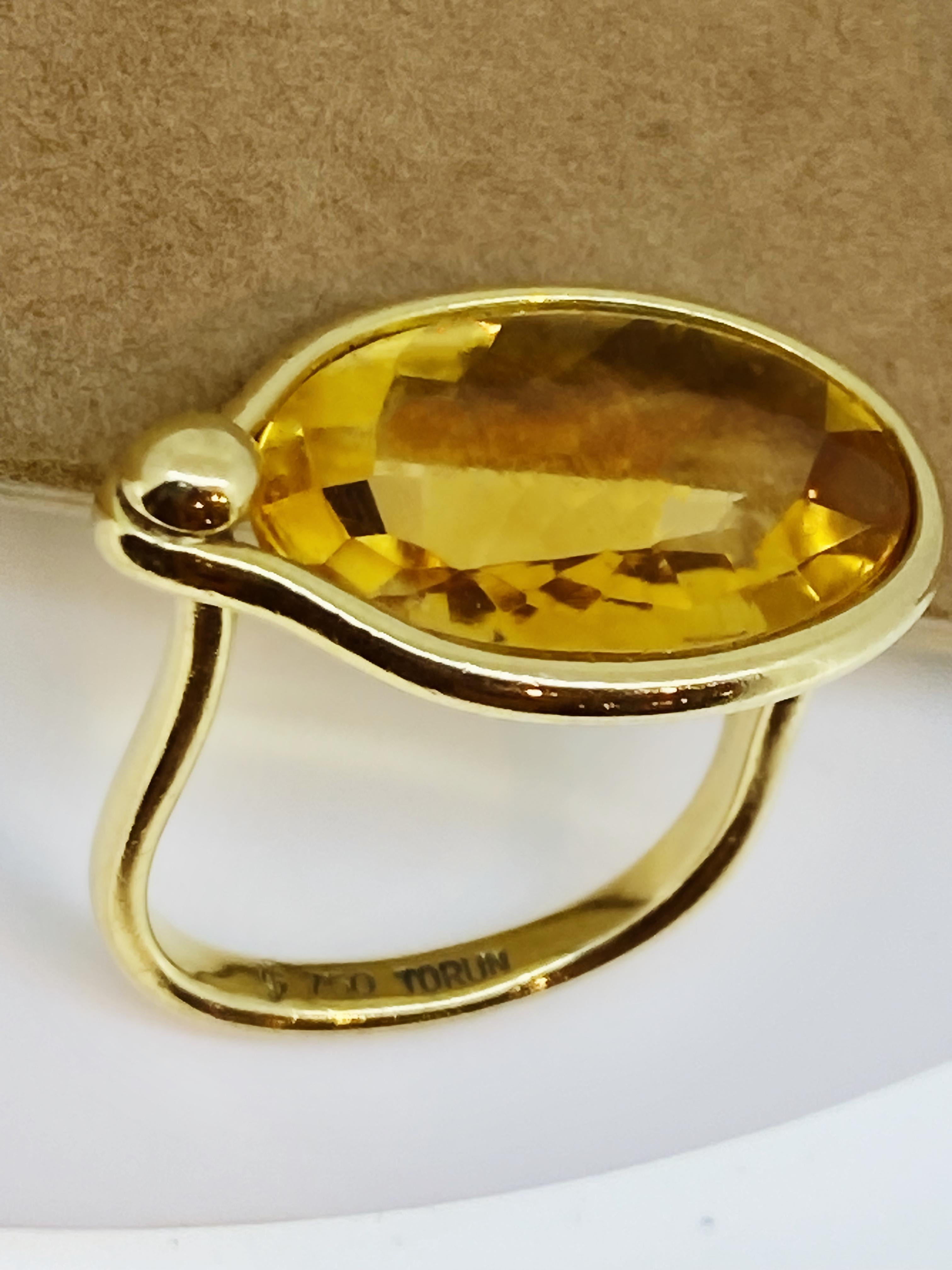 Uniquely designed by renowned Swedish jeweller 
Vivianna Torun Bülow-Hübe
(1927 - 2004) for Georg Jensen, 
this iconic “Savannah” ring (which is no longer in production)
is set with a faceted Natural Citrine of 
rather impressive 12.00ct