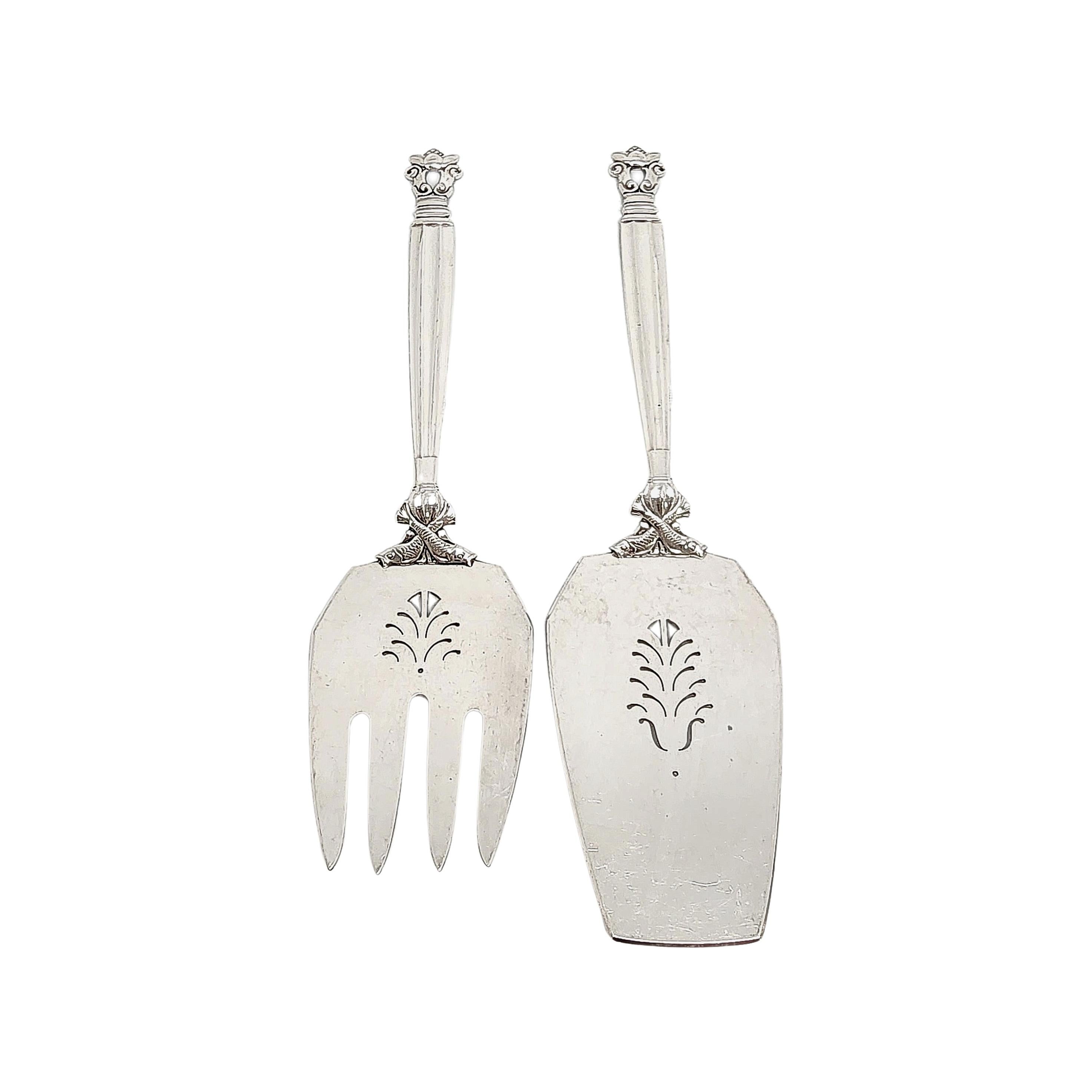 Sterling silver 2pc fish serving set in the Acorn pattern by Georg Jensen.

The Acorn pattern was introduced in 1915 as a collaboration between Georg Jensen and designer Johan Ronde. The Acorn pattern, which combines Art Nouveau and Art Deco styles,