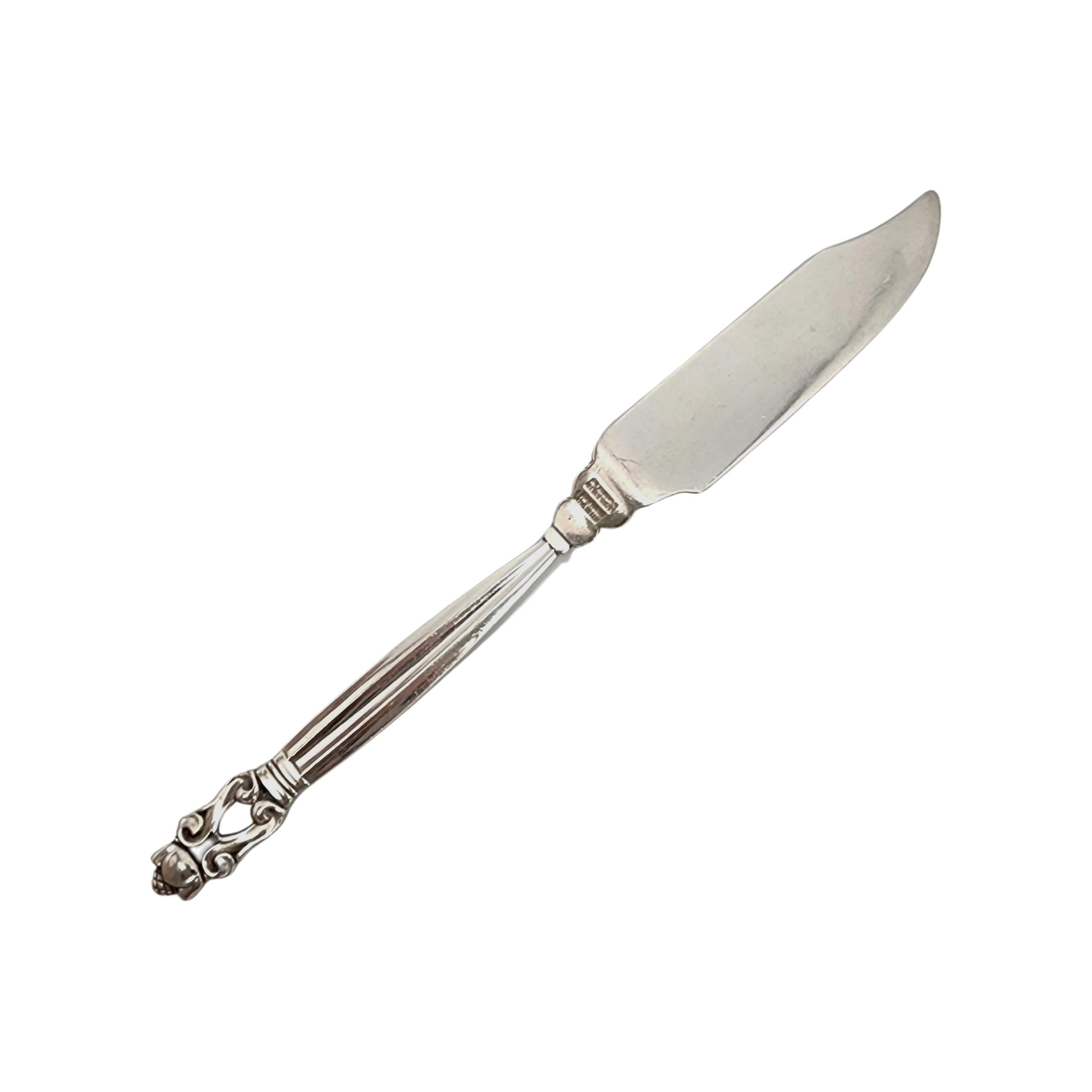 Sterling silver solid  individual fish knife in the Acorn pattern by Georg Jensen.

The Acorn pattern was introduced in 1915 as a collaboration between Georg Jensen and designer Johan Ronde. The Acorn pattern, which combines Art Nouveau and Art Deco