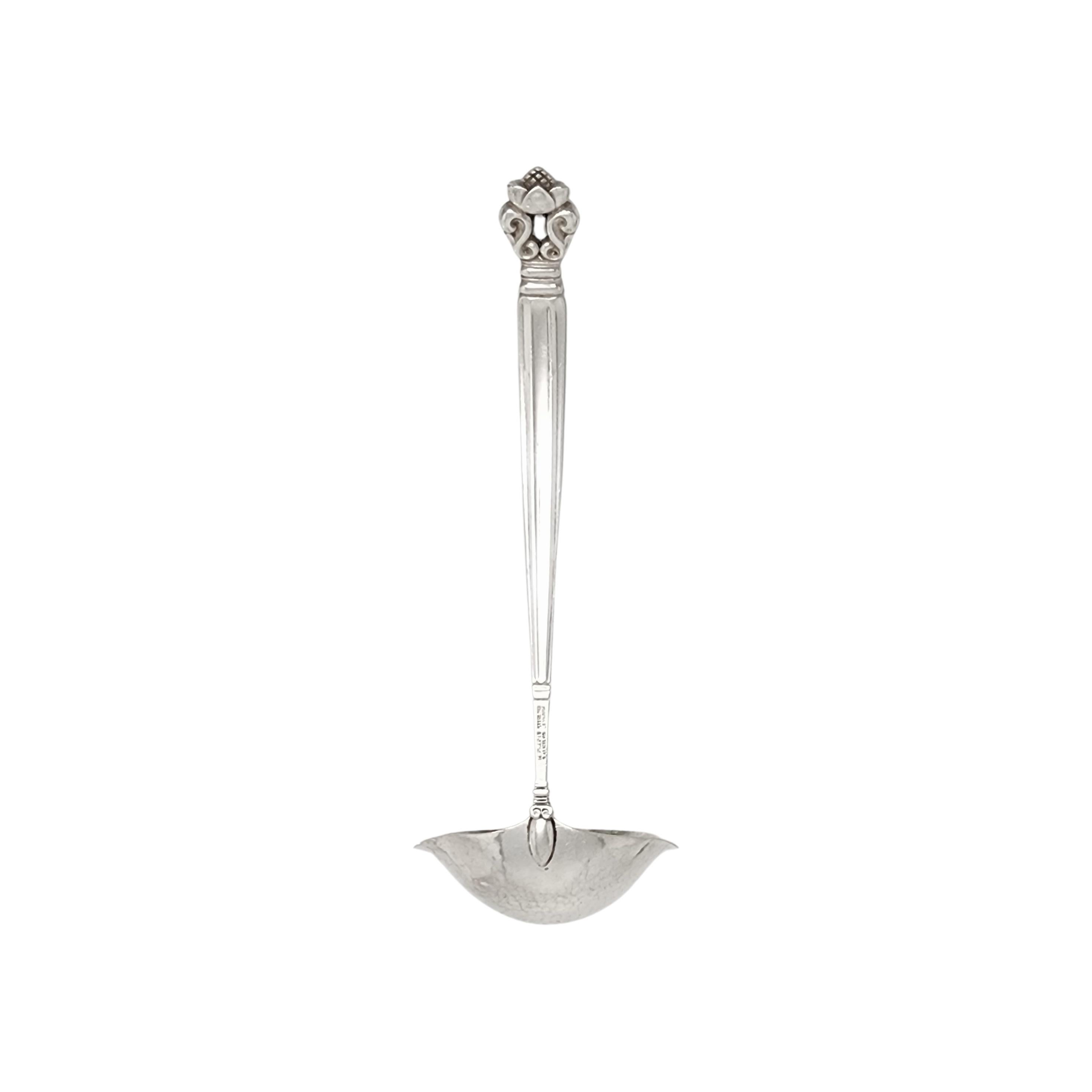Sterling silver gravy ladle in the Acorn pattern by Georg Jensen.

The Acorn pattern was introduced in 1915 as a collaboration between Georg Jensen and designer Johan Ronde. The Acorn pattern, which combines Art Nouveau and Art Deco styles, has