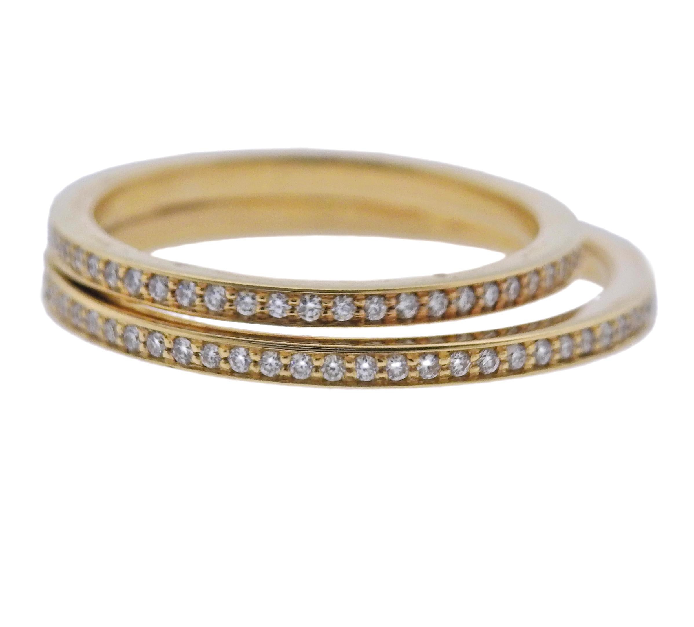 Brand new Georg Jensen 18k yellow gold double pave halo band ring with approx. 0.40ctw G/VS diamonds. Ring size 50, 3.6mm wide. Model # 100014086. Marked: GJ , 750, 50. Weight - 3.8 grams.