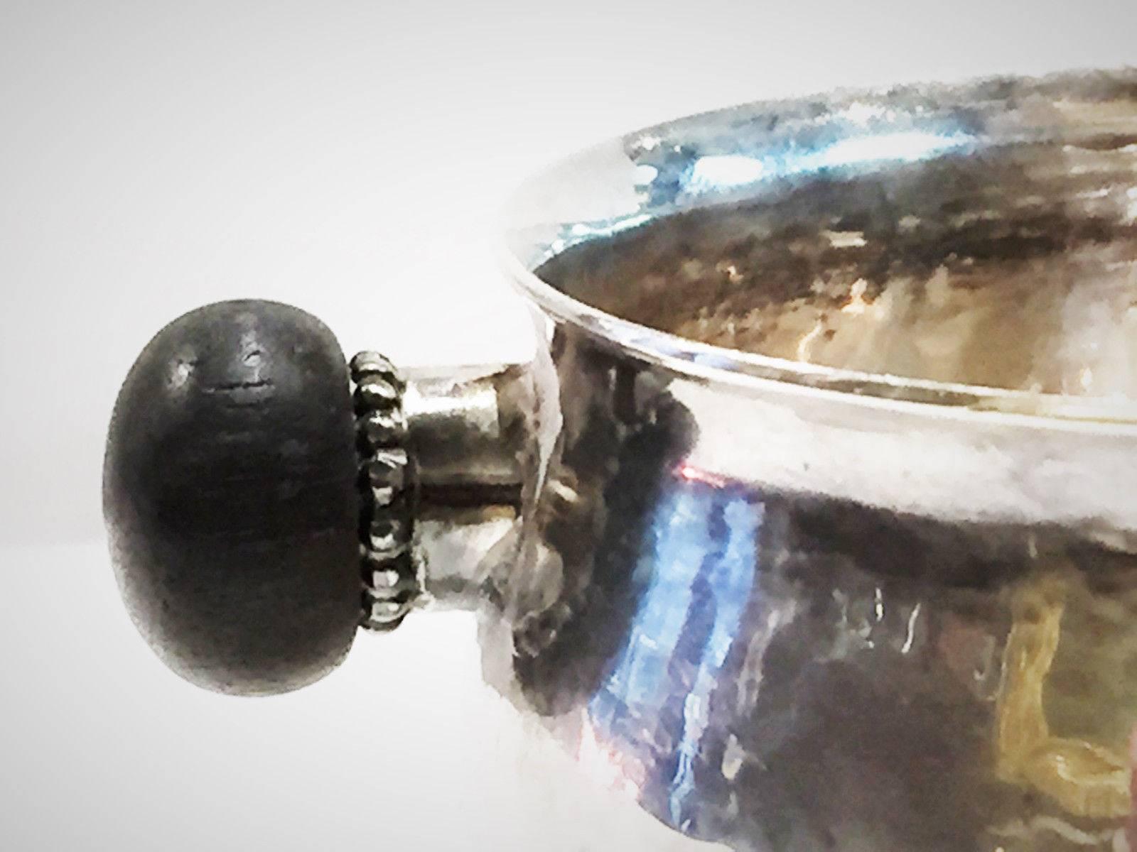 Handmade and lightly hammered sugar bowl with ebony handles and beaded sockets by George Jensen Silversmiths of Copenhagen, Denmark was produced in the period of 1935 - 1944 (Model: 80F). The soft, warm, original finish is present, with no buffing