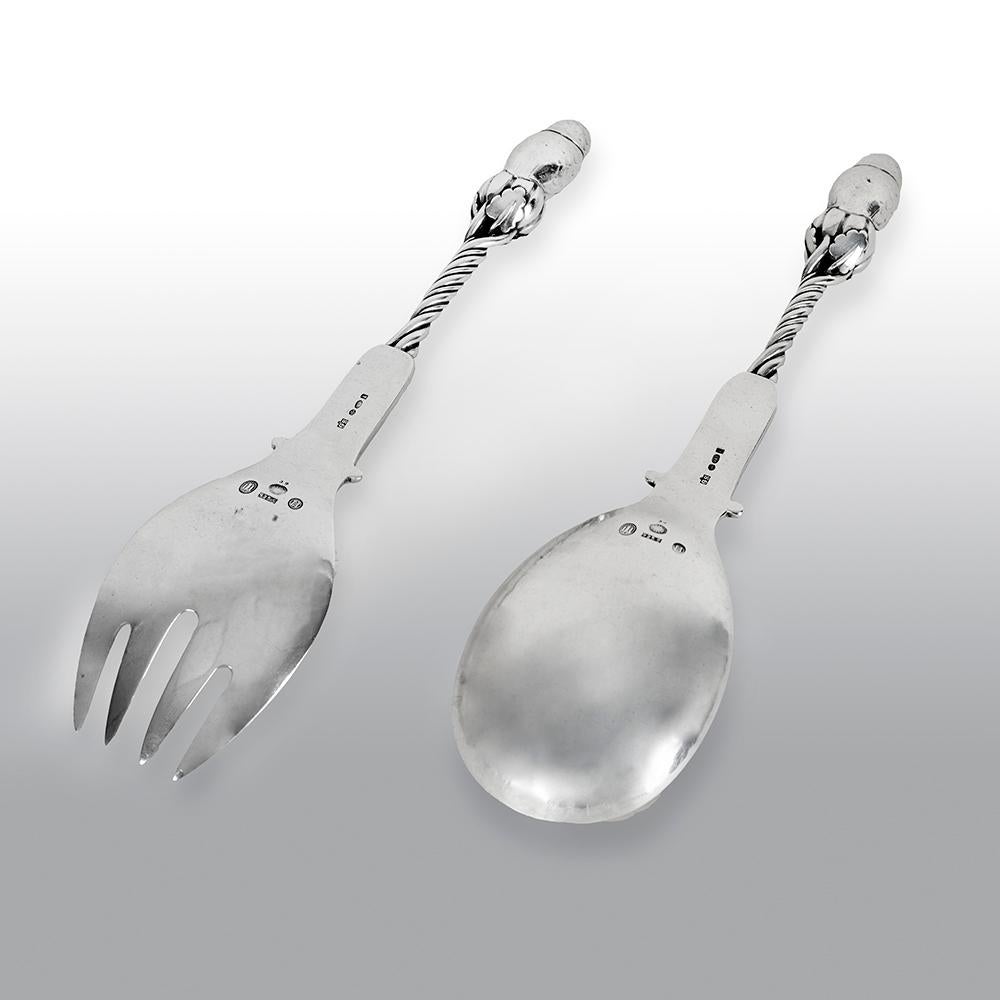 Georg Jensen 'Owl' serving spoon and Fork No. 39. These serving pieces are in a rare and antique 'owl' design by Georg Jensen. The serving fork bears impressed marks for Georg Jensen circa 1915-1930, Denmark, Sterling. This serving spoon is in a