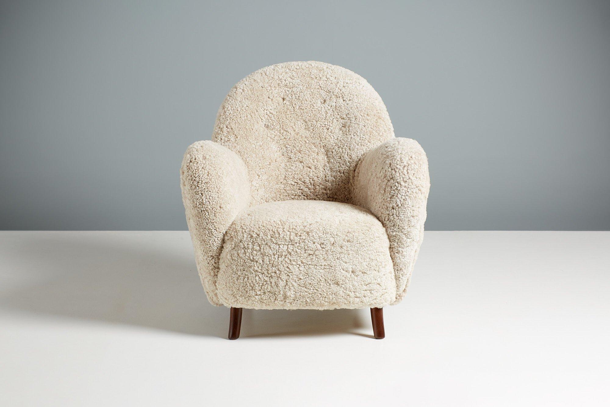 Georg Kofoed Sheepskin Lounge chair, circa 1940s.

Rarely seen and highly sought-after lounge chair from Danish master-cabinetmaker George Kofoed. The chair dates from the early 1940s and features wonderfully curvaceous arms and back. The chair has