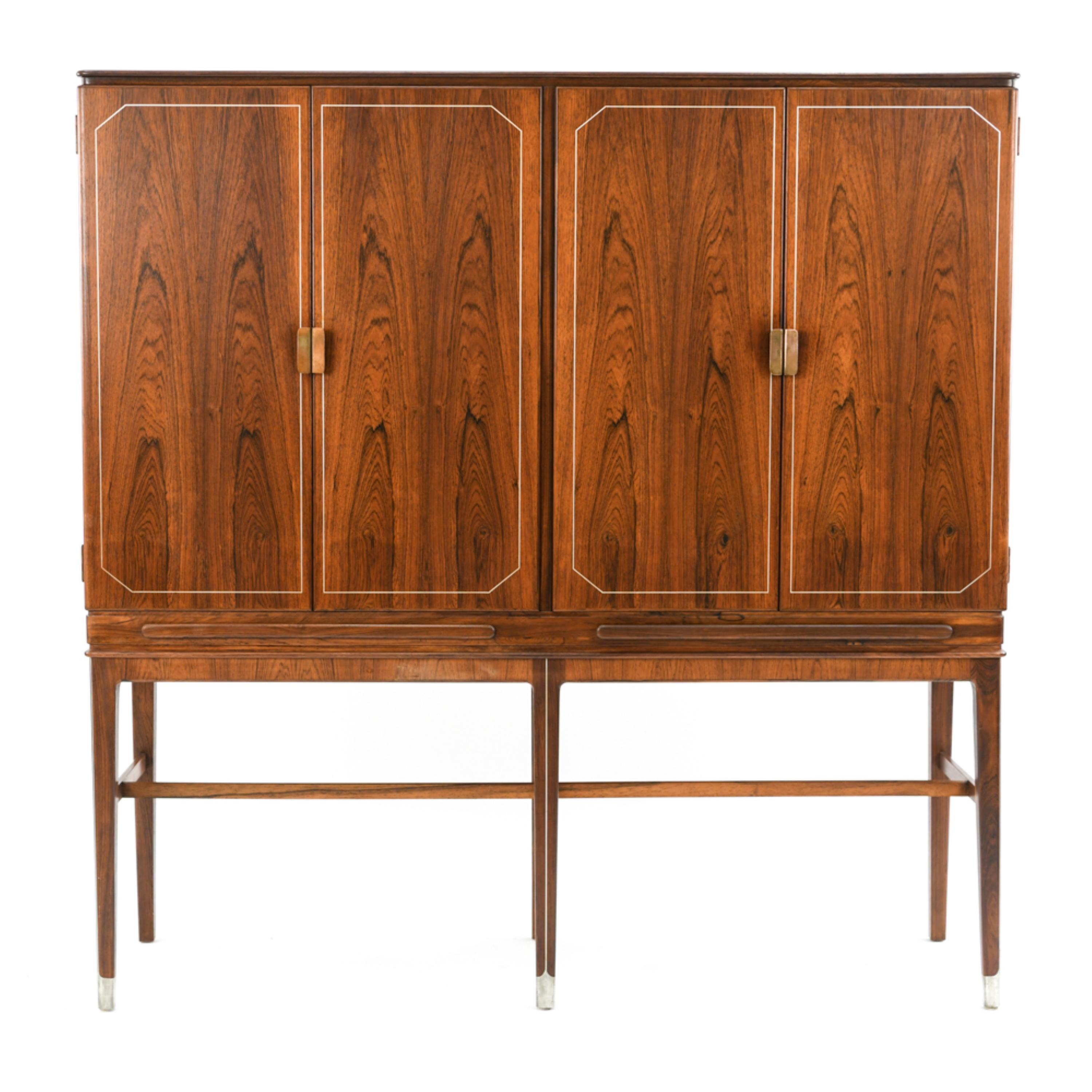 A gorgeous Danish midcentury cupboard cabinet by Georg Kofoed in rosewood.