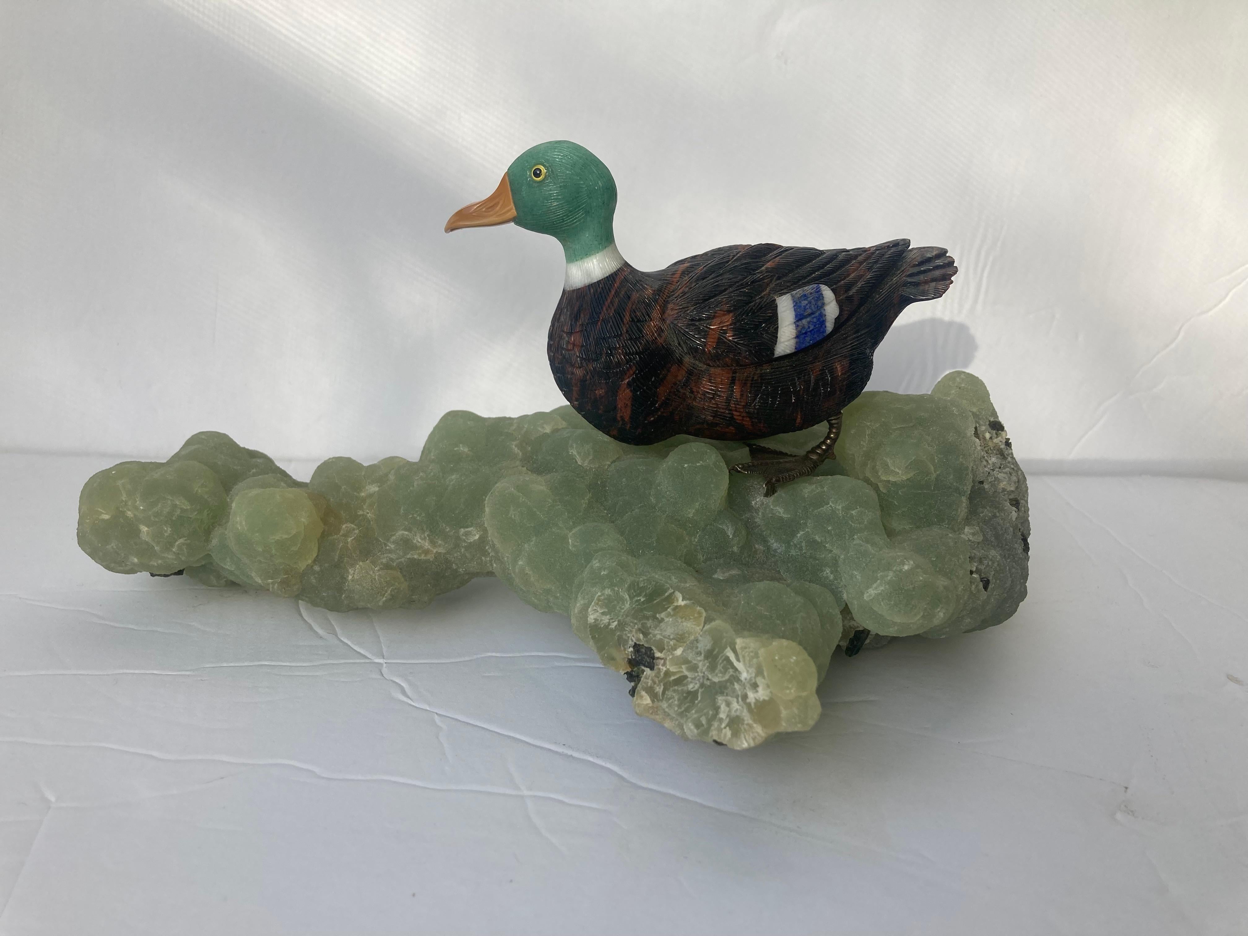 Beautiful carving by the well Idar Oberstein artist Georg Wild. Made with multi gemstone and on top of Australian botryoidal phrenite specimen and yellow 18K gold feet, marked 750.