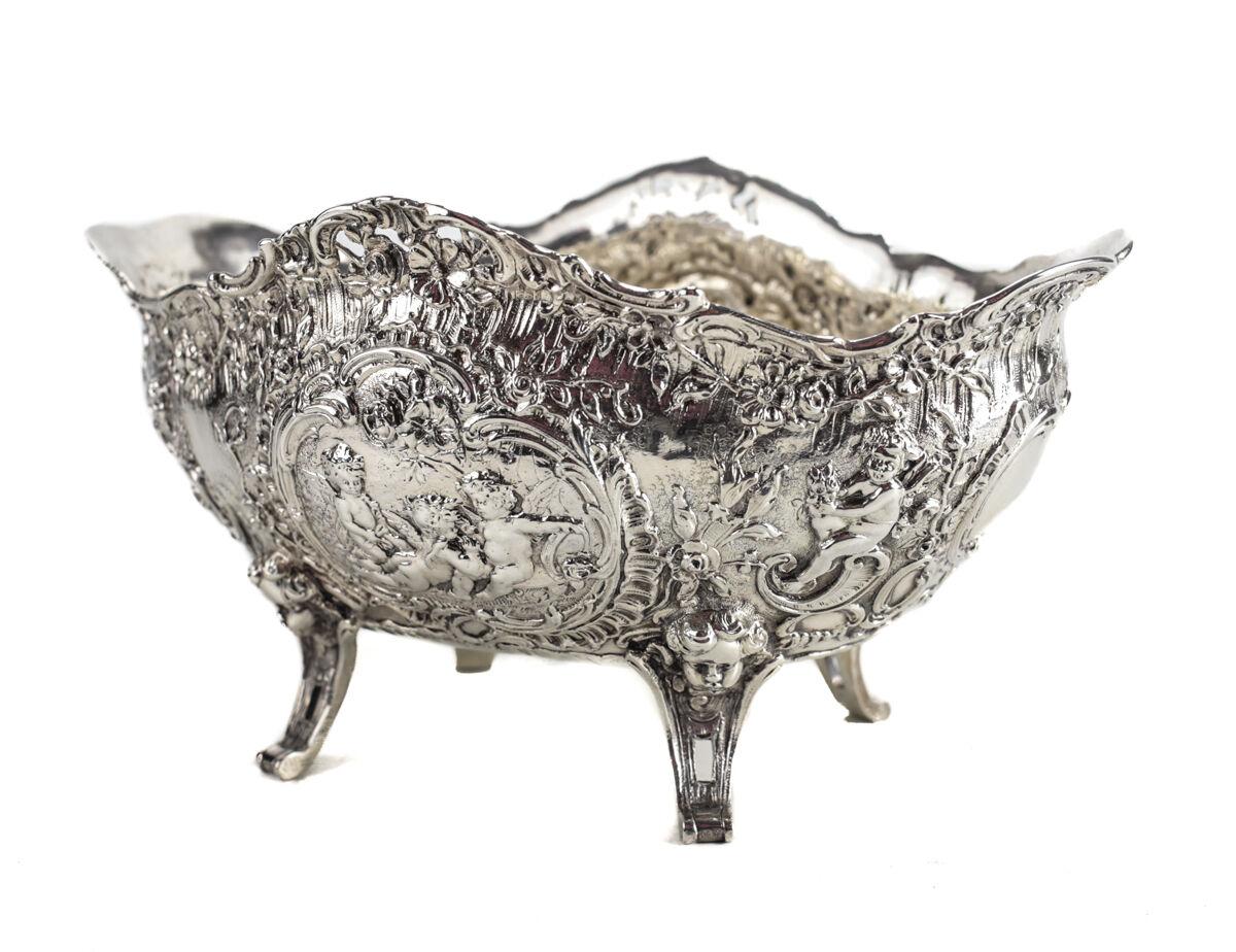 Georg Roth German Hanau Sterling .930 Silver with London import marks for William Moering. Footed basket and/or centerpiece bowl, circa 1900. Intricate repousse floral decoration and cherubs throughout the bowl, with pierce border. Maker, silver and