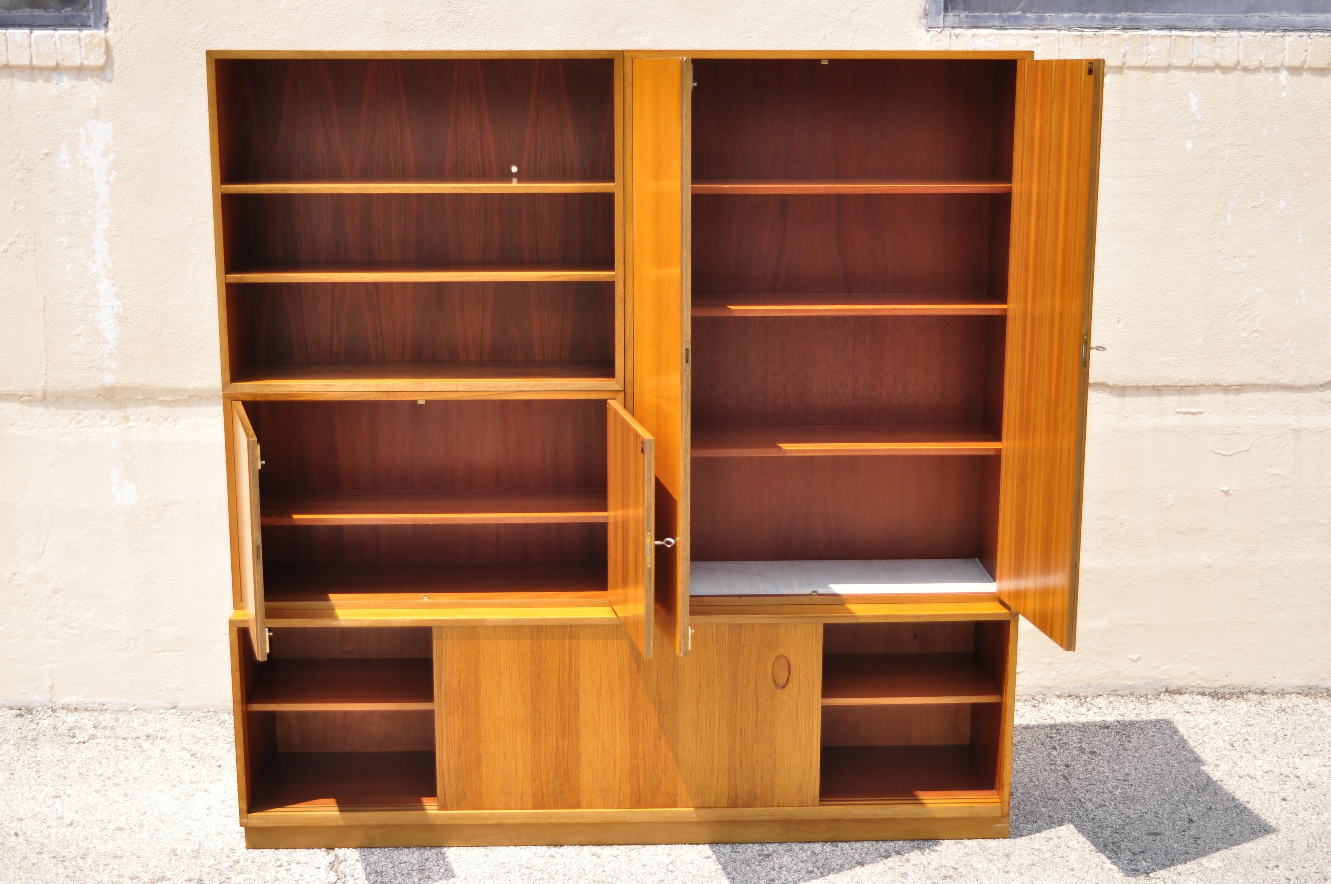 Georg Satink for WK Mobel teak modular wall unit credenza cabinet German Danish Modern. Item features beautiful wood grain, 4 part construction, original labels, working locks and keys, adjustable shelves, clean Modernist lines, great style and