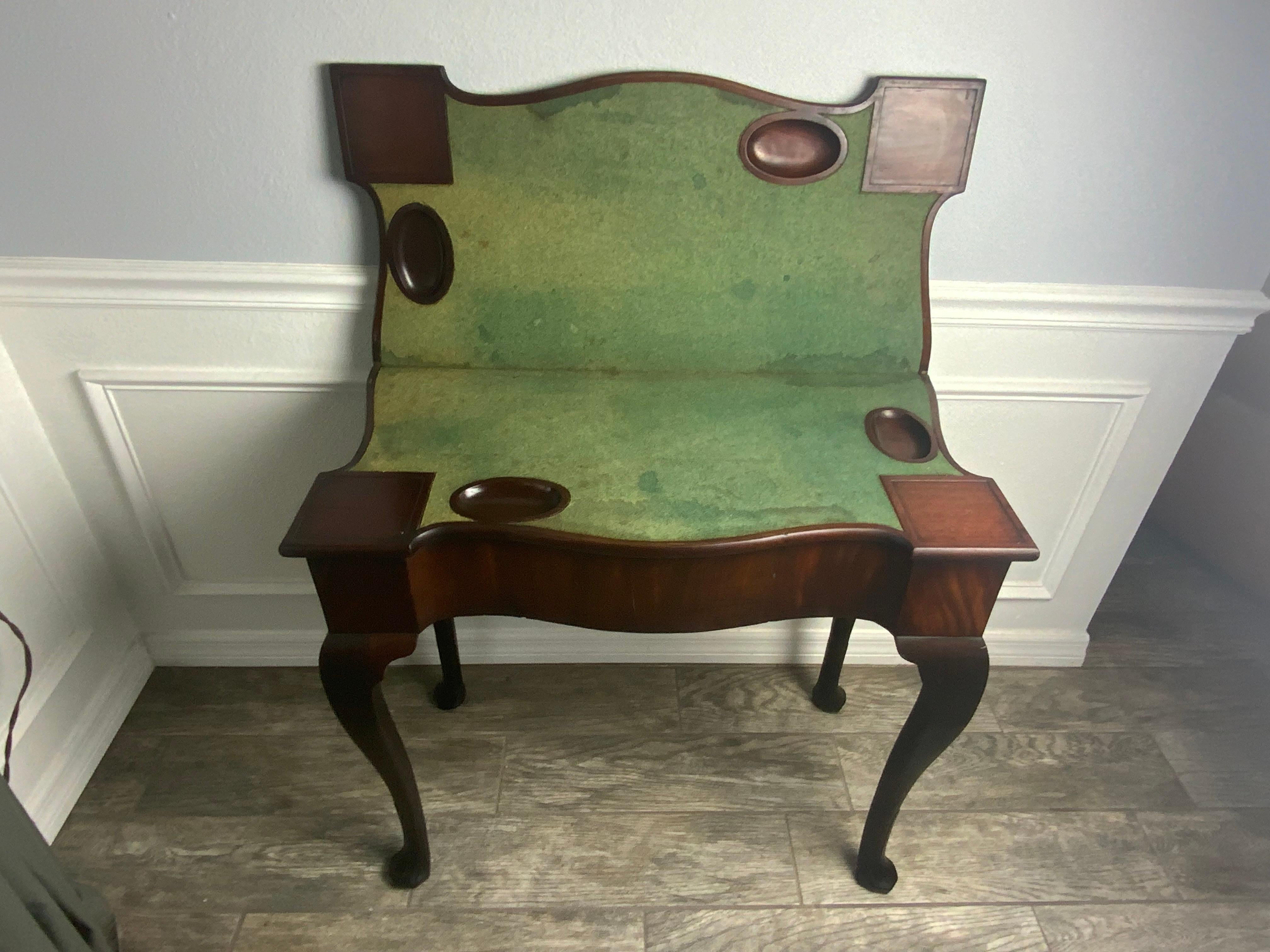 Very nice George 11 Mahogany card table in its original surface.  Cabriole legs ending in nicely carved trifid feet.  This piece has an early Spillman & Company label that was applied to it around 100 years after it was made.  Starting in the 19th