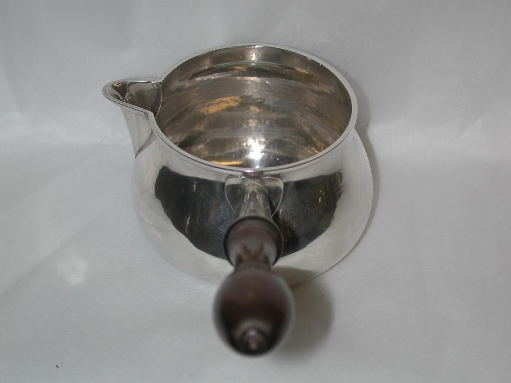 Heavy gauge silver brandy saucepan, assayed in London in 1777.
Made by Robert Makepeace and Richard Carter in London.
Originally hand hammered all over, and burnished on the out-side surfaces.
