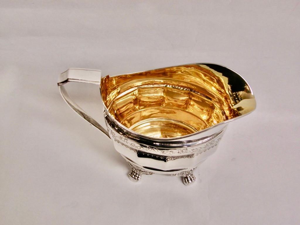 George 111 silver bright Cut creamer, dated 1803, Assayed In London
Good quality cream jug made by Duncan Urquhart & Napthali Hart.
This partnership made fine quality silverware with a heavy gauge of silver.
Their bright cut engraving was the