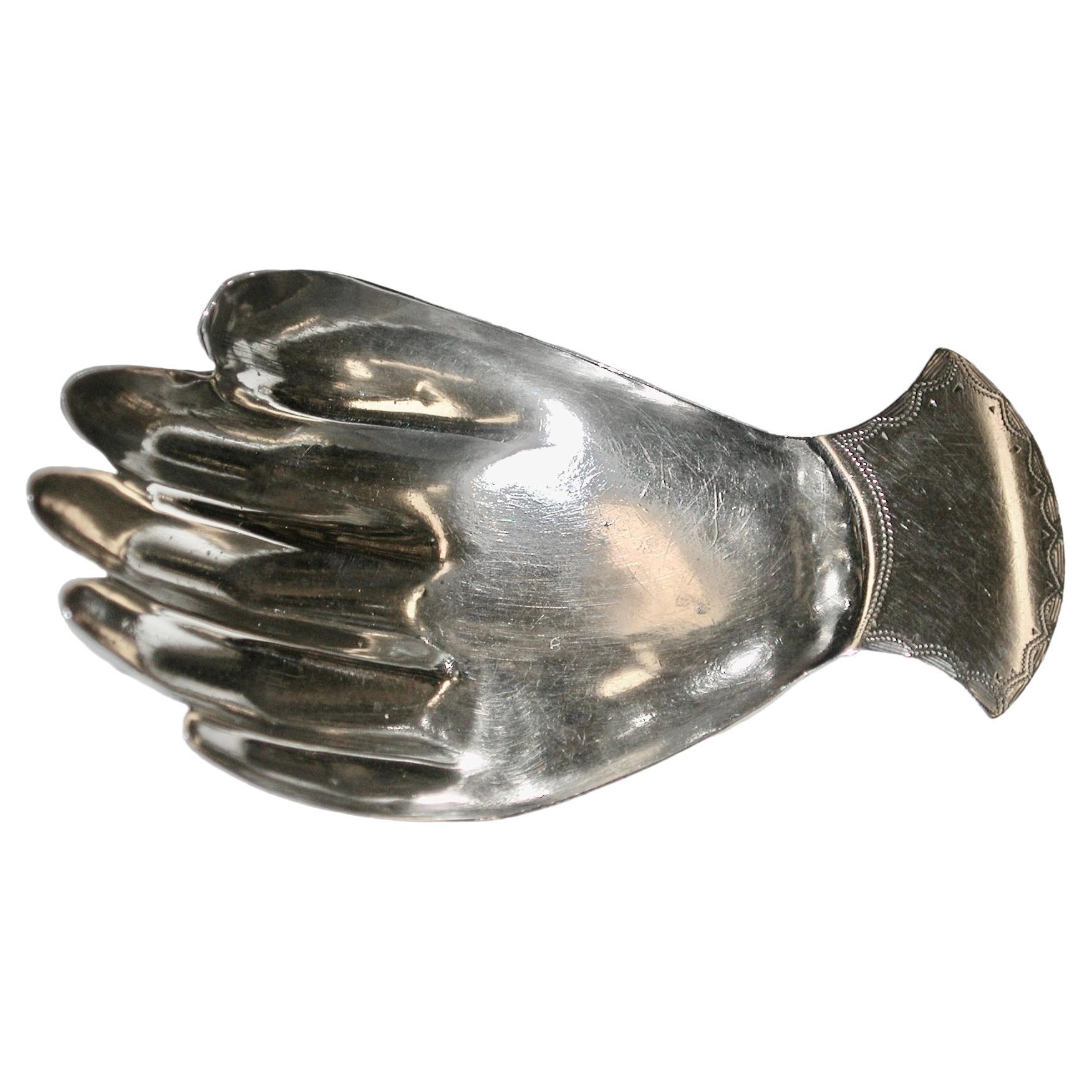 George 111 Silver Hand Caddy Spoon London by Josiah Snatt dated  1812
A rare George III silver Caddy Spoon, made in the form of a right hand, the cuff shaped handle with bright-cut engraved decoration.

