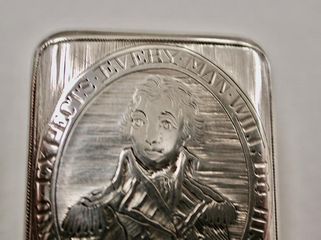George 111 Silver Nelson Vinaigrette By Matthew Linwood Birmingham 1805 
George III silver Nelson commemorative rectangular vinaigrette, the hinged lid engraved with Admiral Lord Nelson in an oval cartouche, inscribed 'England Expects Every Man will