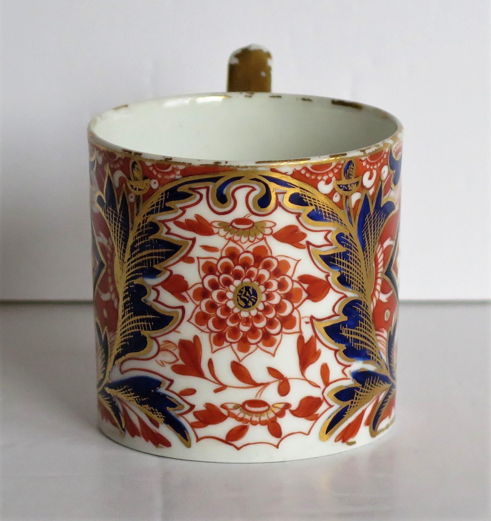 This is a highly collectable, hand painted porcelain coffee can (cup) , made by Derby porcelain Co., England in the George III period, circa 1810.

The coffee can is nominally straight sided and about 2.5 inches square excluding the handle. The