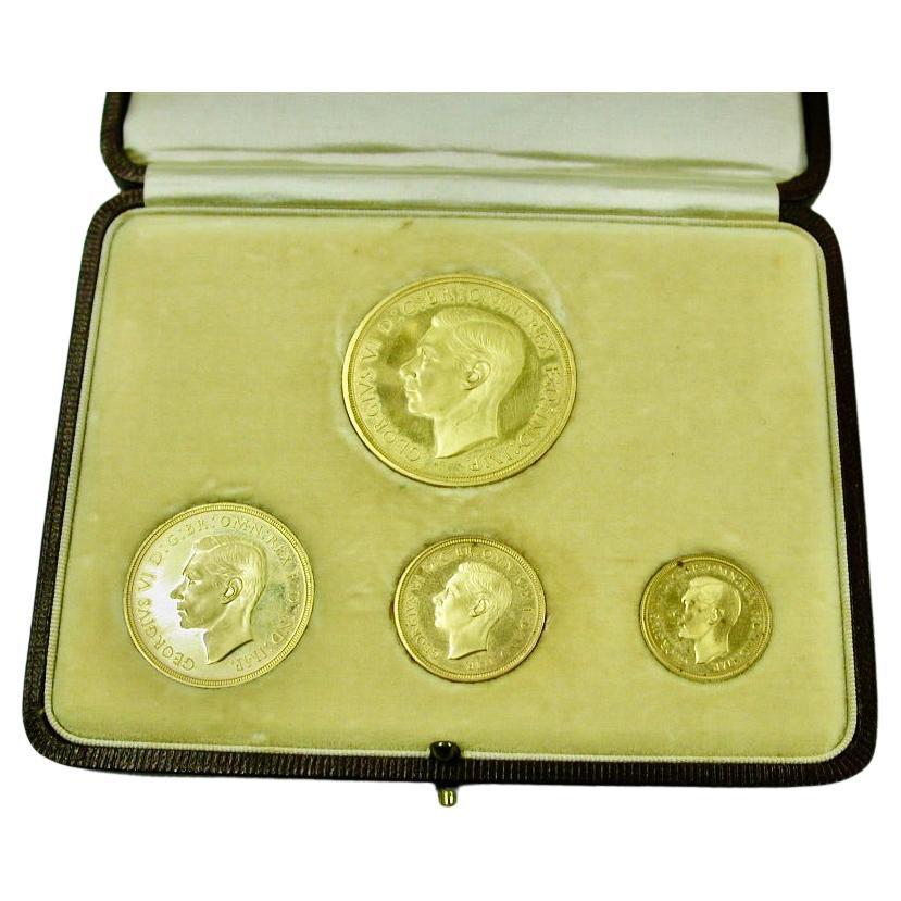 GEORGE VI 1937 GOLD FOUR COIN SPECIMEN SET,
comprising five pounds, two pounds, sovereign and half sovereign, in fitted red leather case,

1937 is the only year that gold coins were minted under the sixteen year reign of George VI. When minted, they